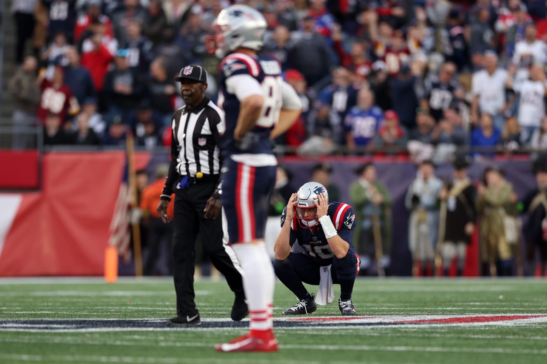 FOXBOROUGH, MASSACHUSETTS - NOVEMBER 05: Mac Jones #10 of the New England Patriots reacts after an interception during the second half in the game against the Washington Commanders at Gillette Stadium on November 05, 2023 in Foxborough, Massachusetts. (Photo by Maddie Meyer/Getty Images)