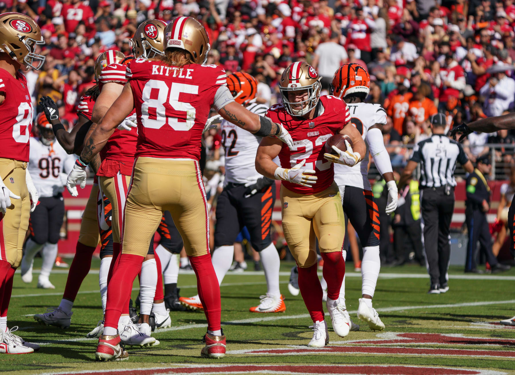 SANTA CLARA, CALIFORNIA - OCTOBER 29: Christian McCaffrey #23 of the San Francisco 49ers celebrates scoring a touchdown with teammate George Kittle #85 during the first half of an NFL football game against the Cincinnati Bengals at Levi's Stadium on October 29, 2023 in Santa Clara, California. (Photo by Loren Elliott/Getty Images)