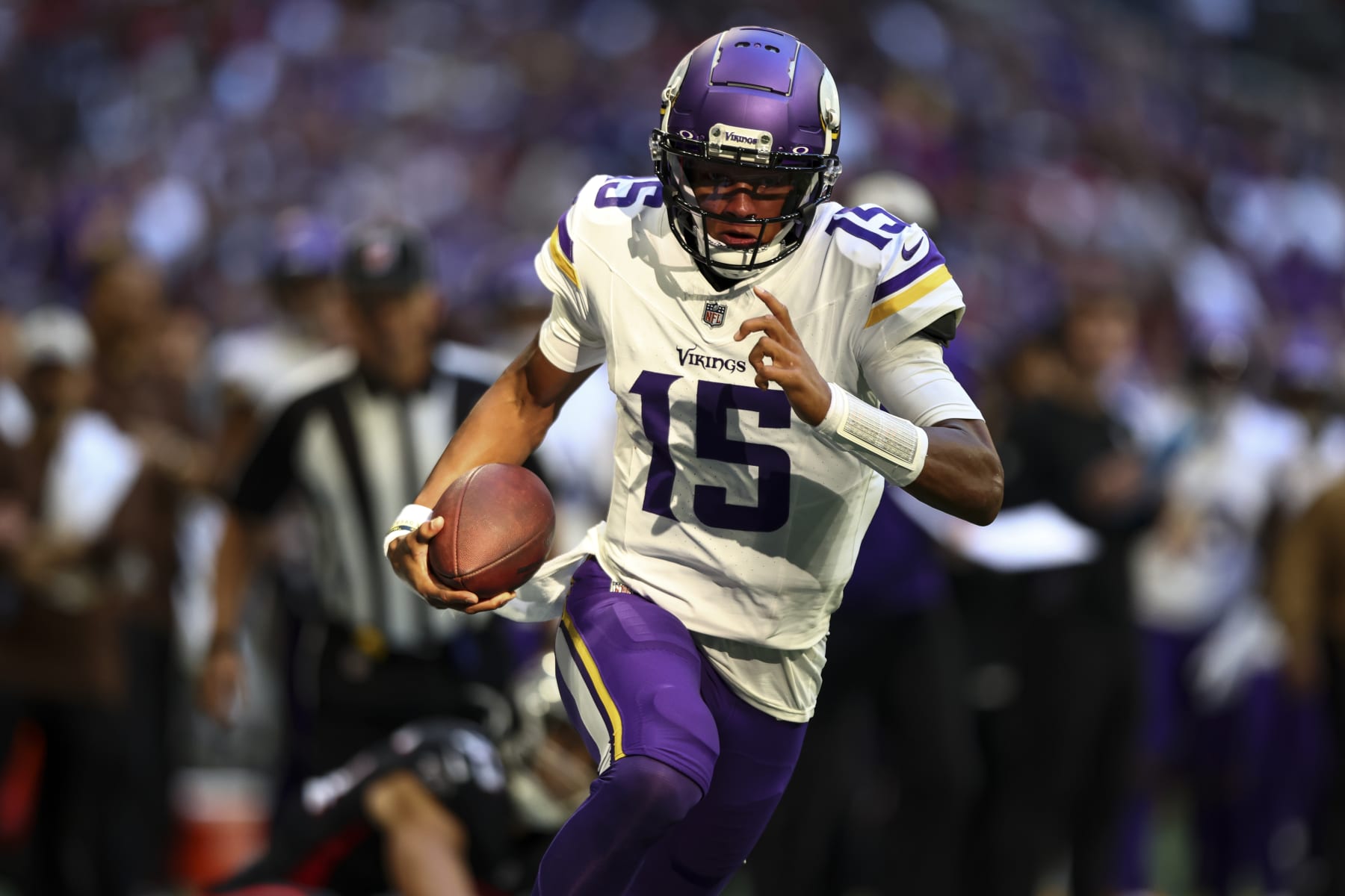 ATLANTA, GA - NOVEMBER 5: Joshua Dobbs #15 of the Minnesota Vikings carries the ball for a touchdown during the third quarter of an NFL football game against the Atlanta Falcons at Mercedes-Benz Stadium on November 5, 2023 in Atlanta, Georgia. (Photo by Kevin Sabitus/Getty Images)