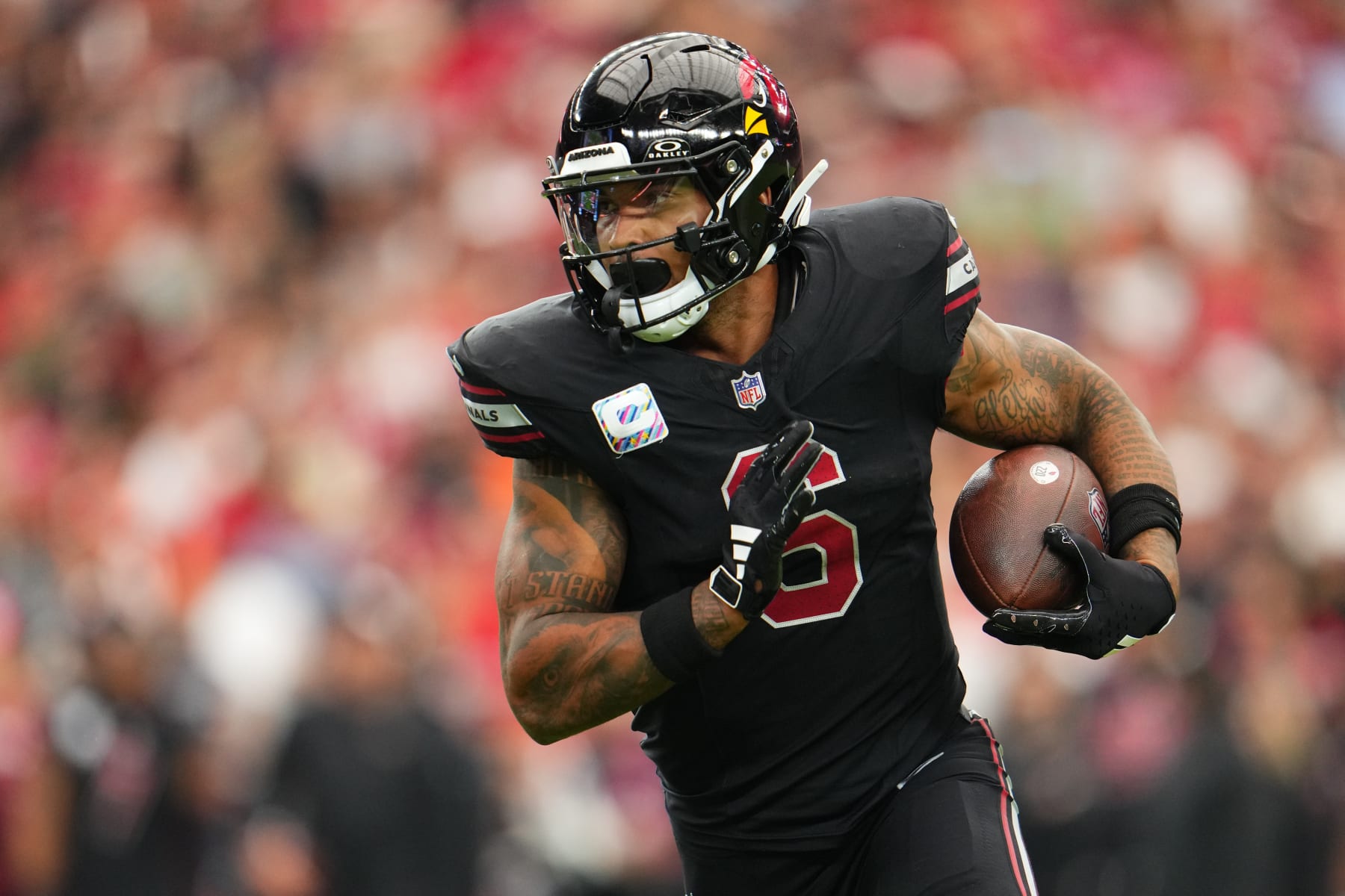 GLENDALE, AZ - OCTOBER 08: James Conner #6 of the Arizona Cardinals carries the ball against the Cincinnati Bengals during the first half at State Farm Stadium on October 8, 2023 in Glendale, Arizona. (Photo by Cooper Neill/Getty Images)