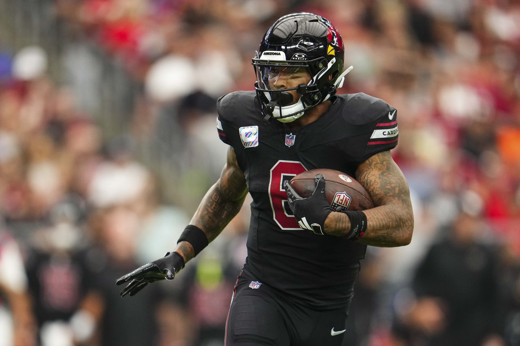 GLENDALE, AZ - OCTOBER 08: James Conner #6 of the Arizona Cardinals runs the ball during an NFL game against the Cincinnati Bengals at State Farm Stadium on October 8, 2023 in Glendale, Arizona. (Photo by Cooper Neill/Getty Images)