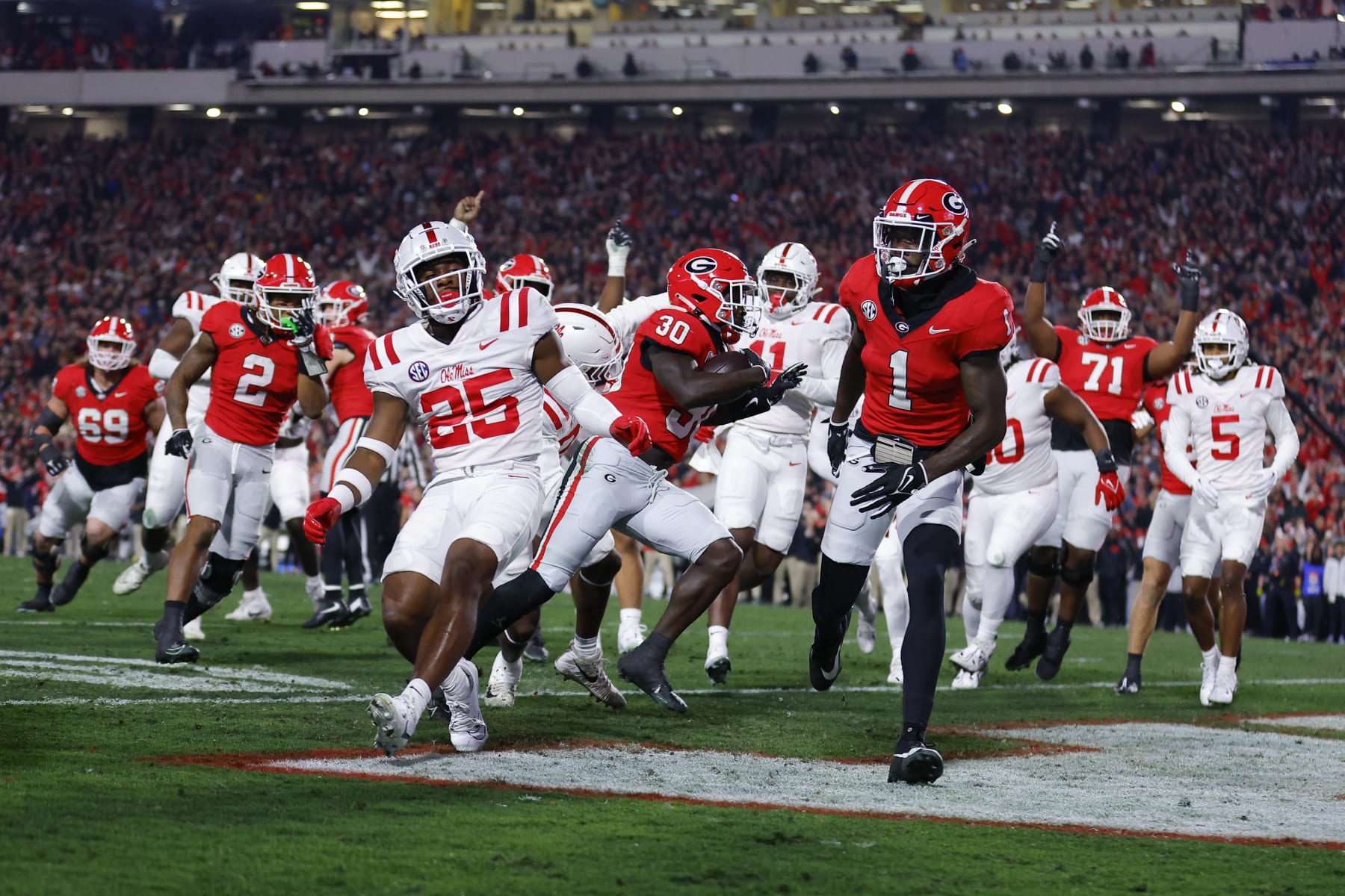 ATHENS, GEORGIA - NOVEMBER 11: Daijun Edwards #30 of the Georgia Bulldogs rushes in for a touchdown during the first quarter against the Mississippi Rebels at Sanford Stadium on November 11, 2023 in Athens, Georgia. (Photo by Todd Kirkland/Getty Images)