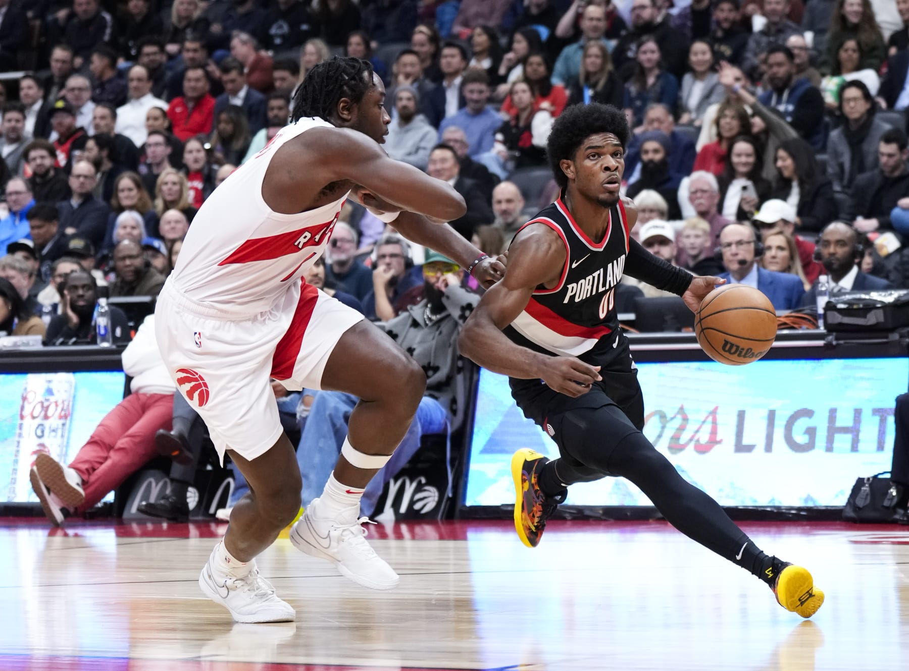 TORONTO, ON - OCTOBER 30: Scoot Henderson #00 of the Portland Trail Blazers drives against O.G. Anunoby #3 of the Toronto Raptors during the first half of their basketball game at the Scotiabank Arena on October 30, 2023 in Toronto, Ontario, Canada. NOTE TO USER: User expressly acknowledges and agrees that, by downloading and/or using this Photograph, user is consenting to the terms and conditions of the Getty Images License Agreement. (Photo by Mark Blinch/Getty Images) TORONTO, ON - OCTOBER 30: Scoot Henderson #00 of the Portland Trail Blazers drives against O.G. Anunoby #3 of the Toronto Raptors during the first half of their basketball game at the Scotiabank Arena on October 30, 2023 in Toronto, Ontario, Canada. NOTE TO USER: User expressly acknowledges and agrees that, by downloading and/or using this Photograph, user is consenting to the terms and conditions of the Getty Images License Agreement. (Photo by Mark Blinch/Getty Images)