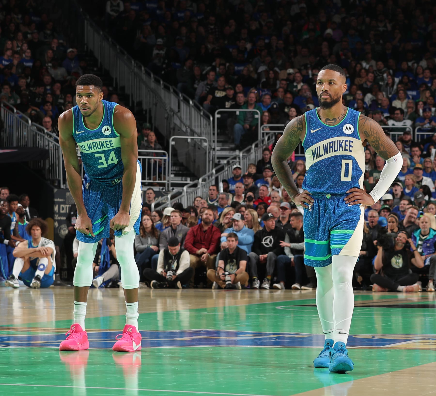 MILWAUKEE, WI - NOVEMBER 3: Damian Lillard #0 and Giannis Antetokounmpo #34 of the Milwaukee Bucks look on during the In Season Tournament against the New York Knicks on November 3, 2023 at the Fiserv Forum Center in Milwaukee, Wisconsin. NOTE TO USER: User expressly acknowledges and agrees that, by downloading and or using this Photograph, user is consenting to the terms and conditions of the Getty Images License Agreement. Mandatory Copyright Notice: Copyright 2023 NBAE (Photo by Gary Dineen/NBAE via Getty Images). MILWAUKEE, WI - NOVEMBER 3: Damian Lillard #0 and Giannis Antetokounmpo #34 of the Milwaukee Bucks look on during the In Season Tournament against the New York Knicks on November 3, 2023 at the Fiserv Forum Center in Milwaukee, Wisconsin. NOTE TO USER: User expressly acknowledges and agrees that, by downloading and or using this Photograph, user is consenting to the terms and conditions of the Getty Images License Agreement. Mandatory Copyright Notice: Copyright 2023 NBAE (Photo by Gary Dineen/NBAE via Getty Images).