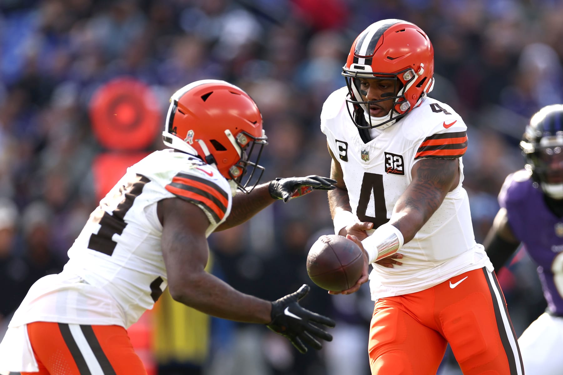 Browns QB Deshaun Watson hands off to RB Jerome Ford