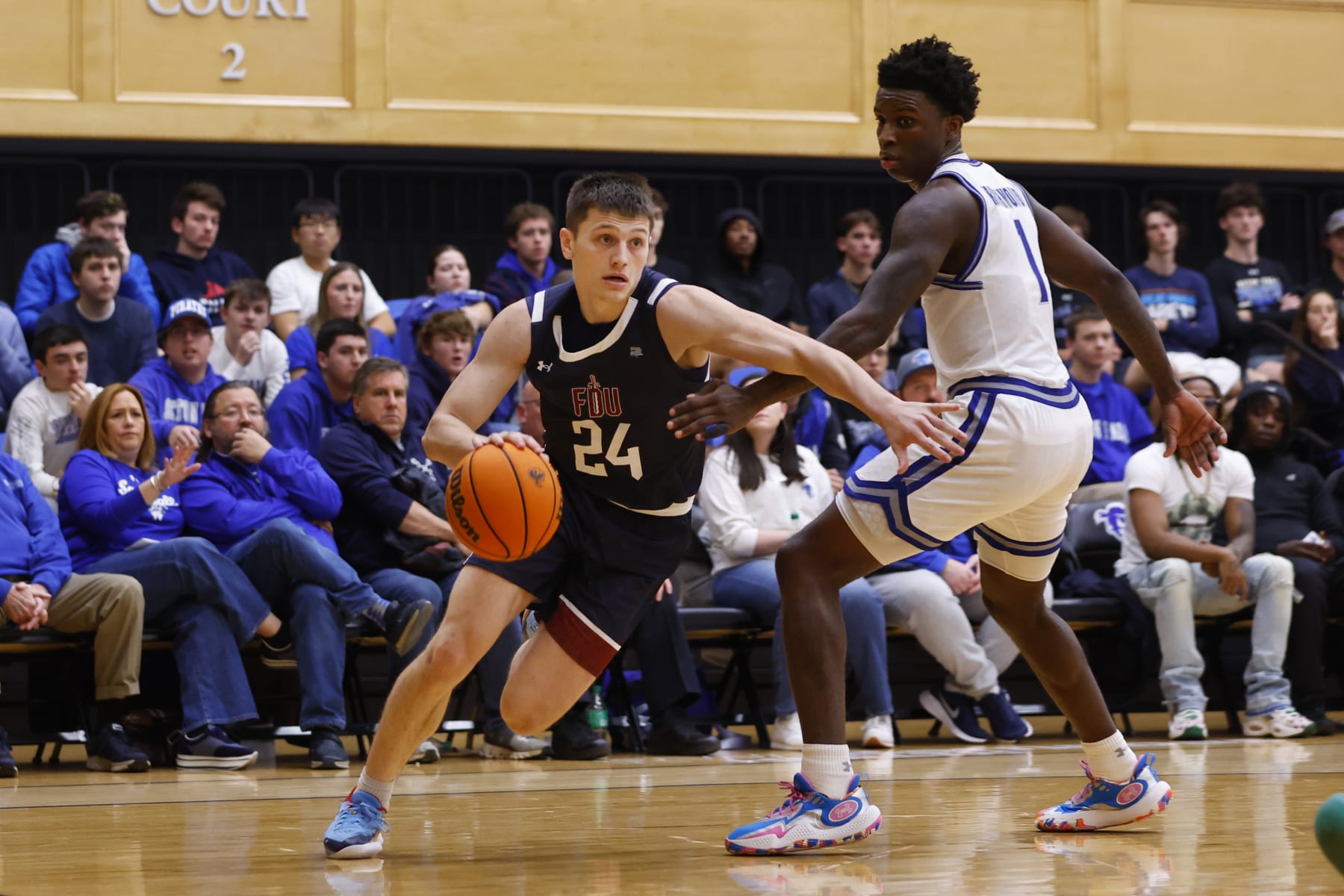 SOUTH ORANGE, NEW JERSEY - NOVEMBER 11: Brayden Reynolds #24 of the Fairleigh Dickinson Knights in action against Kadary Richmond #1 of the Seton Hall Pirates during a game at Walsh Gym on November 11, 2023 in South Orange, New Jersey. Seton Hall defeated FDU 85-55. (Photo by Rich Schultz/Getty Images)