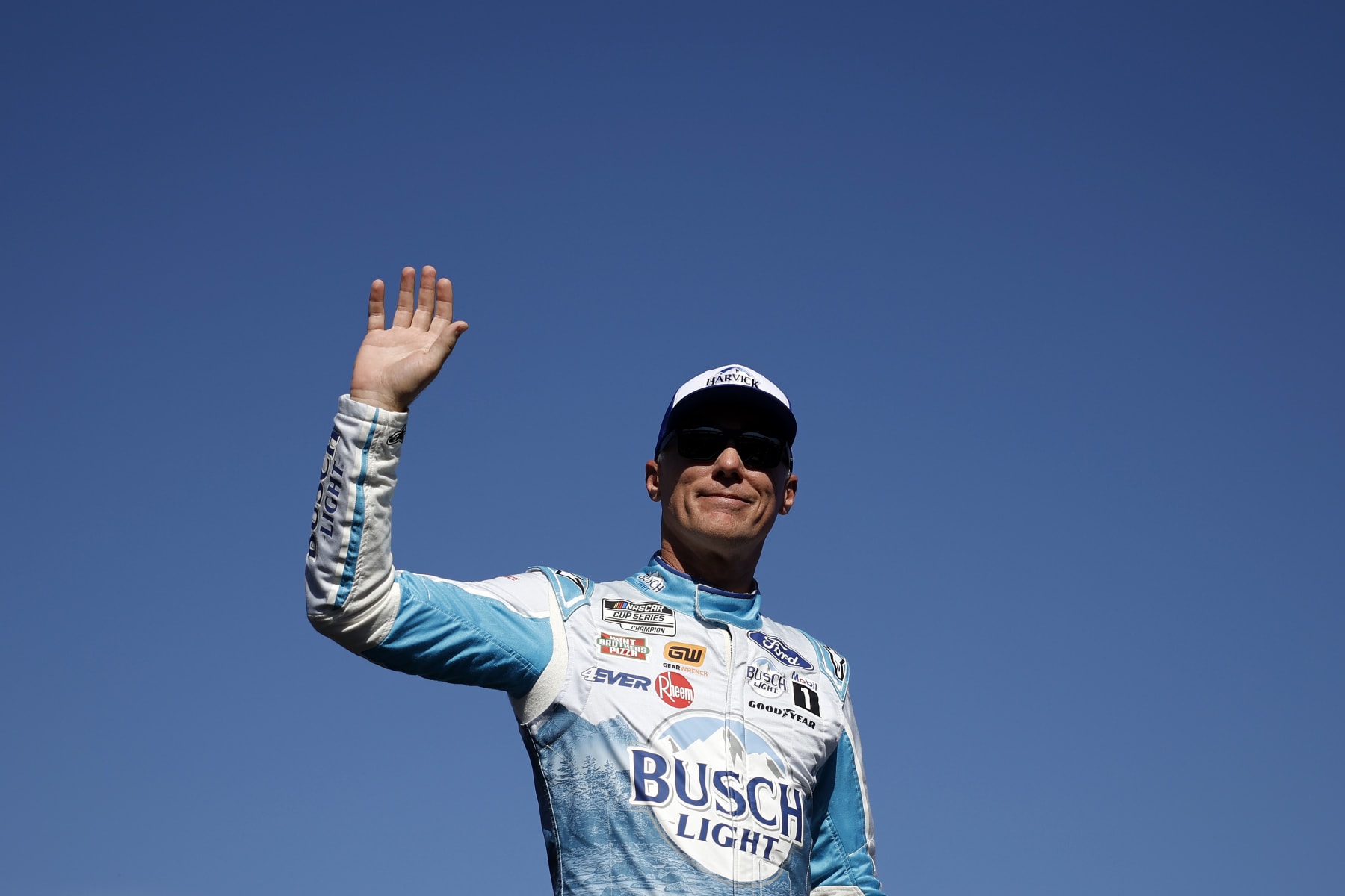 AVONDALE, ARIZONA - NOVEMBER 05: Kevin Harvick, driver of the #4 Busch Light Harvick Ford, waves to fans as he walks onstage during driver intros prior to the NASCAR Cup Series Championship at Phoenix Raceway on November 05, 2023 in Avondale, Arizona. (Photo by James Gilbert/Getty Images)