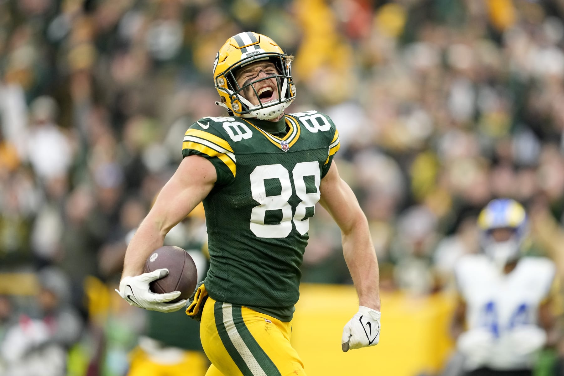 GREEN BAY, WISCONSIN - NOVEMBER 05: Luke Musgrave #88 of the Green Bay Packers reacts after scoring a touchdown in the fourth quarter of a game against the Los Angeles Rams at Lambeau Field on November 05, 2023 in Green Bay, Wisconsin. (Photo by Patrick McDermott/Getty Images)