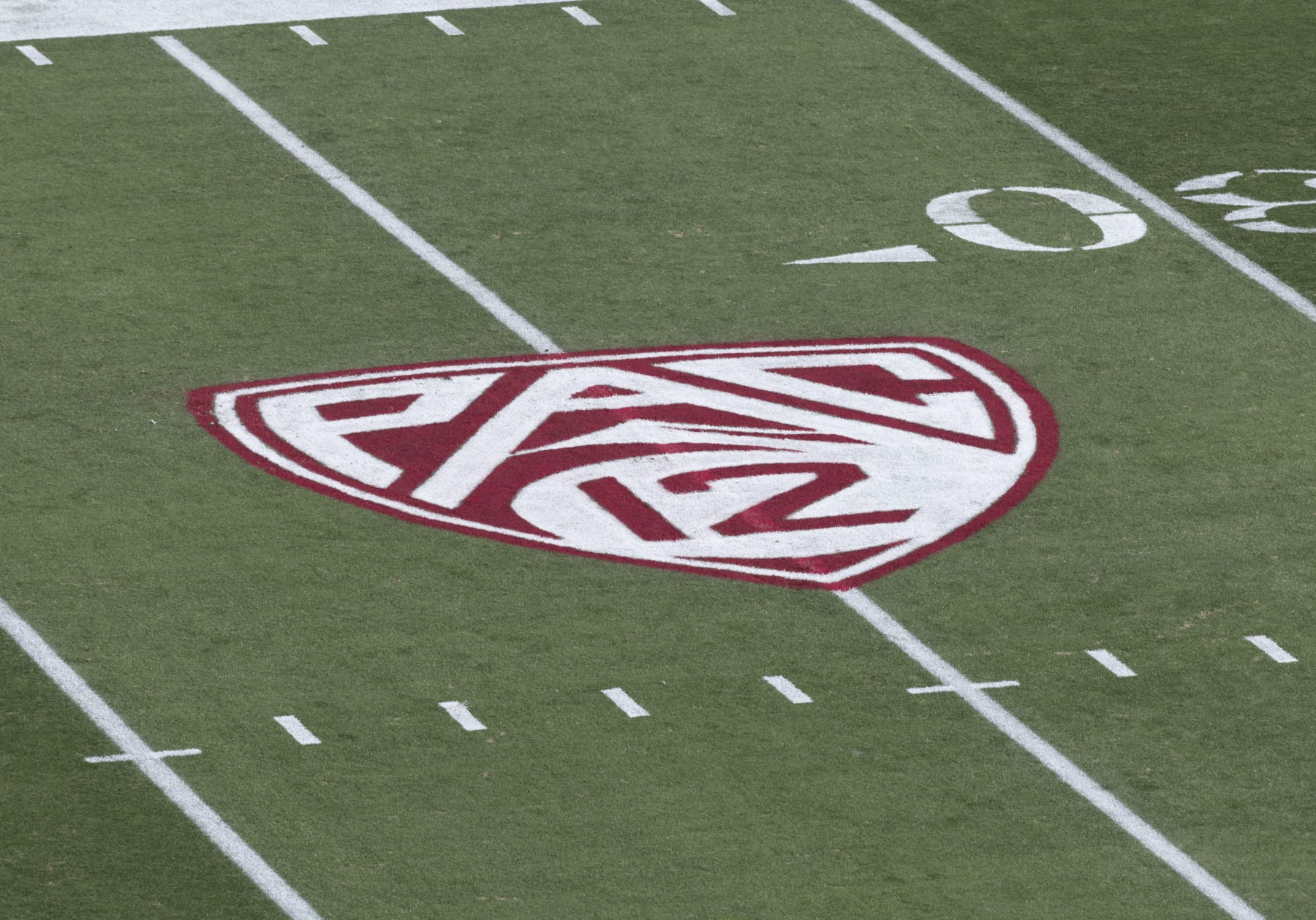 PALO ALTO, CA - OCTOBER  28:  A detail view of the Pac-12 logo on the field at Stanford Stadium before a Pac-12 NCAA college football game between the Stanford Cardinal and the Washington Huskies on October 28, 2023 at Stanford Stadium in Palo Alto, California.  (Photo by David Madison/Getty Images)