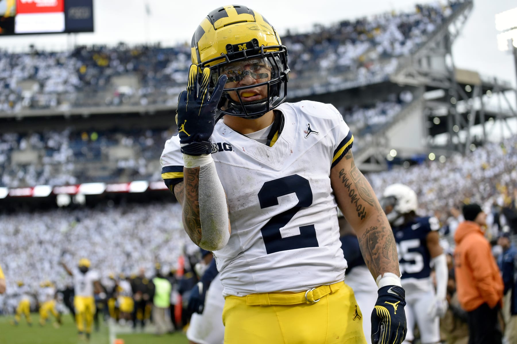 UNIVERSITY PARK, PA - NOVEMBER 11: Michigan running back Blake Corum (2) celebrates by holding up three fingers after scoring a second half touchdown during the Michigan Wolverines versus Penn State Nittany Lions game on November 11, 2023 at Beaver Stadium in University Park, PA. (Photo by Randy Litzinger/Icon Sportswire via Getty Images)