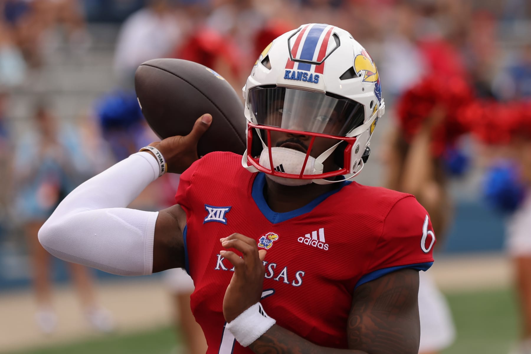 LAWRENCE, KS - SEPTEMBER 23: Kansas Jayhawks quarterback Jalon Daniels (6) throws a pass before a Big 12 football game between the Brigham Young Cougars and Kansas Jayhawks on Sep 23, 2023 at David Booth Memorial Stadium in Lawrence, KS. (Photo by Scott Winters/Icon Sportswire via Getty Images)