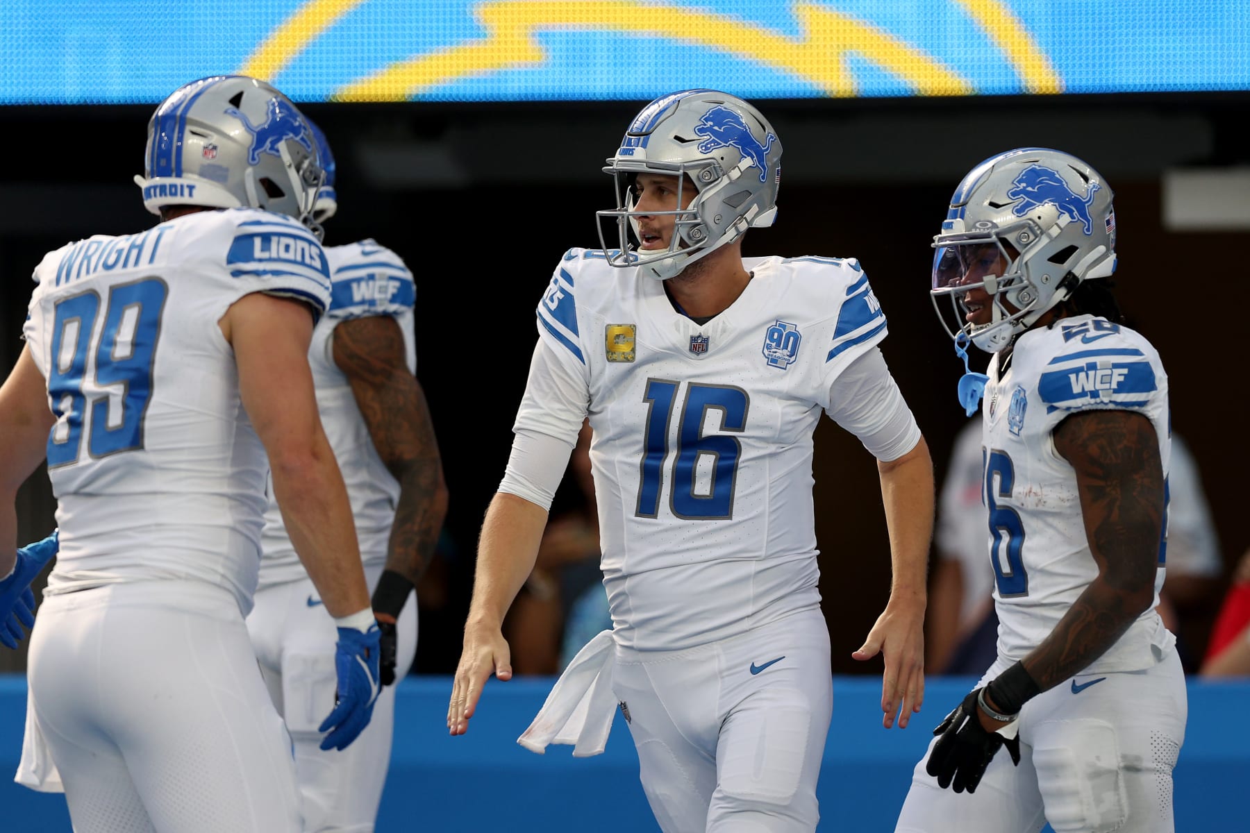 INGLEWOOD, CALIFORNIA - NOVEMBER 12: Jared Goff #16 of the Detroit Lions celebrates a run with Jahmyr Gibbs #26 of the Detroit Lions during the first quarter against the Los Angeles Chargers at SoFi Stadium on November 12, 2023 in Inglewood, California. (Photo by Harry How/Getty Images)