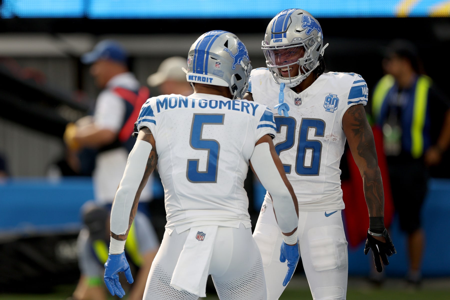 INGLEWOOD, CALIFORNIA - NOVEMBER 12: Jahmyr Gibbs #26 of the Detroit Lions celebrates a touchdown with David Montgomery #5 of the Detroit Lions during the first quarter against the Los Angeles Chargers at SoFi Stadium on November 12, 2023 in Inglewood, California. (Photo by Harry How/Getty Images)
