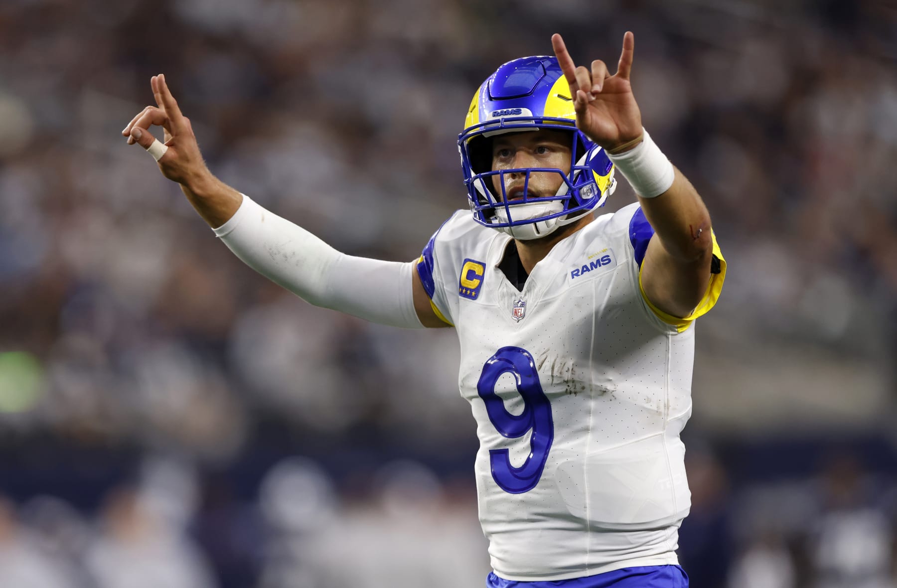 ARLINGTON, TX - OCTOBER 29: Matthew Stafford #9 of the Los Angeles Rams signals for a two point conversion against the Dallas Cowboys at AT&T Stadium on October 29, 2023 in Arlington, Texas. (Photo by Ron Jenkins/Getty Images)