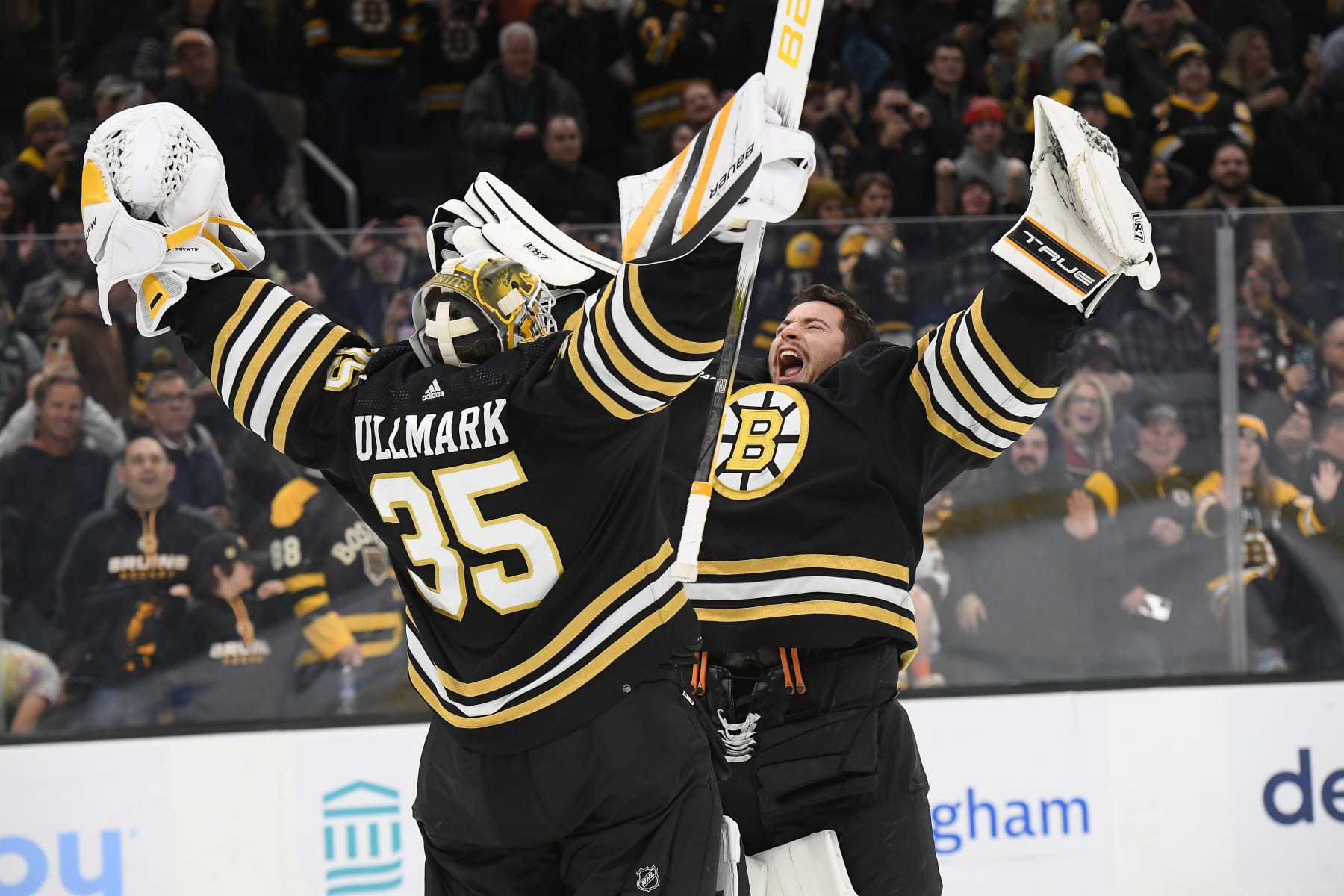 BOSTON, MA - NOVEMBER 9: Linus Ullmark #35 and Jeremy Swayman #1 of the Boston Bruins celebrate their win against the New York Islanders at the TD Garden on November 9, 2023 in Boston, Massachusetts. (Photo by Brian Babineau/NHLI via Getty Images)