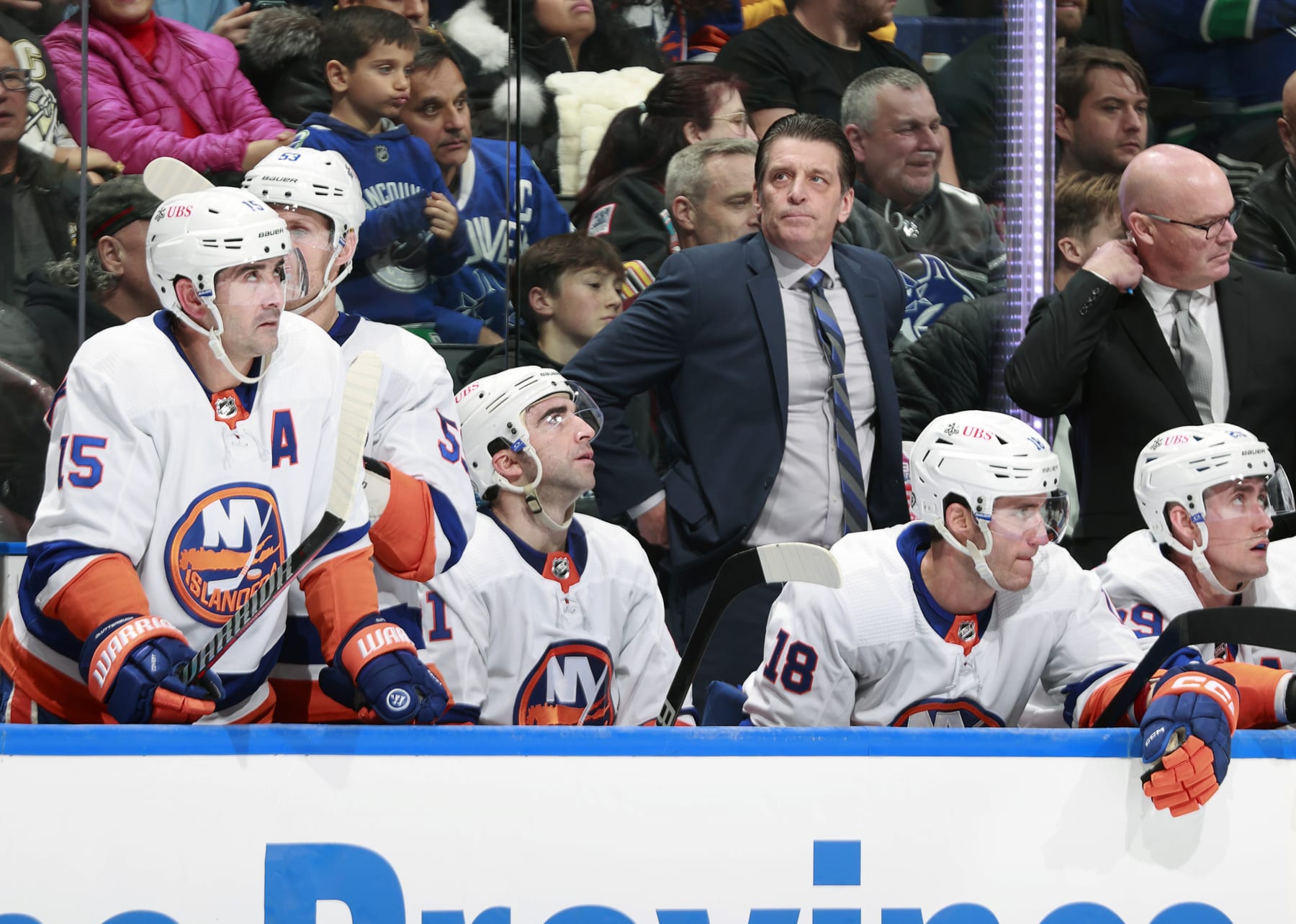 VANCOUVER, CANADA - NOVEMBER 15: Head coach Lane Lambert of the New York Islanders looks on from the bench during their NHL game against the Vancouver Canucks at Rogers Arena on November 15, 2023 in Vancouver, British Columbia, Canada. (Photo by Jeff Vinnick/NHLI via Getty Images)