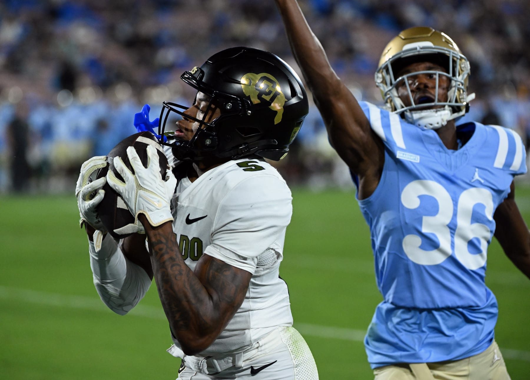 PASADENA, CA - OCTOBER 28: Colorado Buffaloes wide receiver Jimmy Horn Jr. (5) catches a pass for a touchdown in the second half of an NCAA football game against the UCLA Bruins played on October 28, 2023 at the Rose Bowl in Pasadena, CA. (Photo by John Cordes/Icon Sportswire via Getty Images)
