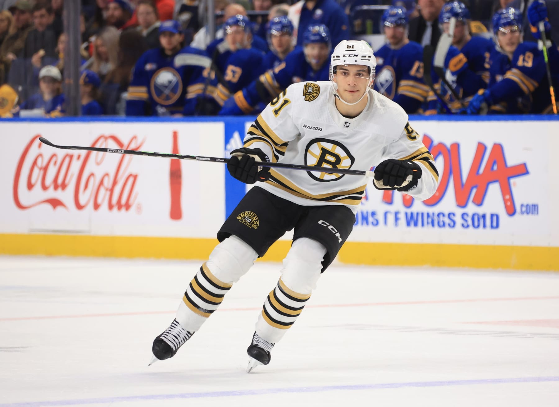 BUFFALO, NEW YORK - NOVEMBER 14: Matthew Poitras #51 of the Boston Bruins skates against the Buffalo Sabres during an NHL game on November 14, 2023 at KeyBank Center in Buffalo, New York. (Photo by Bill Wippert/NHLI via Getty Images)