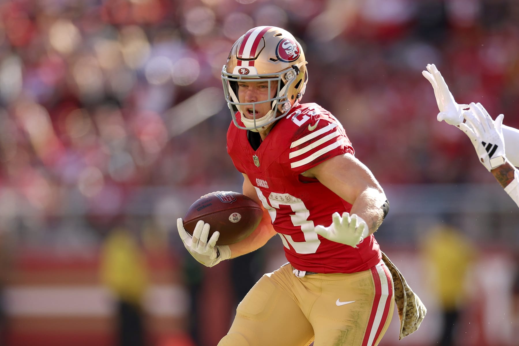 SANTA CLARA, CALIFORNIA - NOVEMBER 19: Christian McCaffrey #23 of the San Francisco 49ers runs with the ball against the Tampa Bay Buccaneers at Levi's Stadium on November 19, 2023 in Santa Clara, California. (Photo by Ezra Shaw/Getty Images)