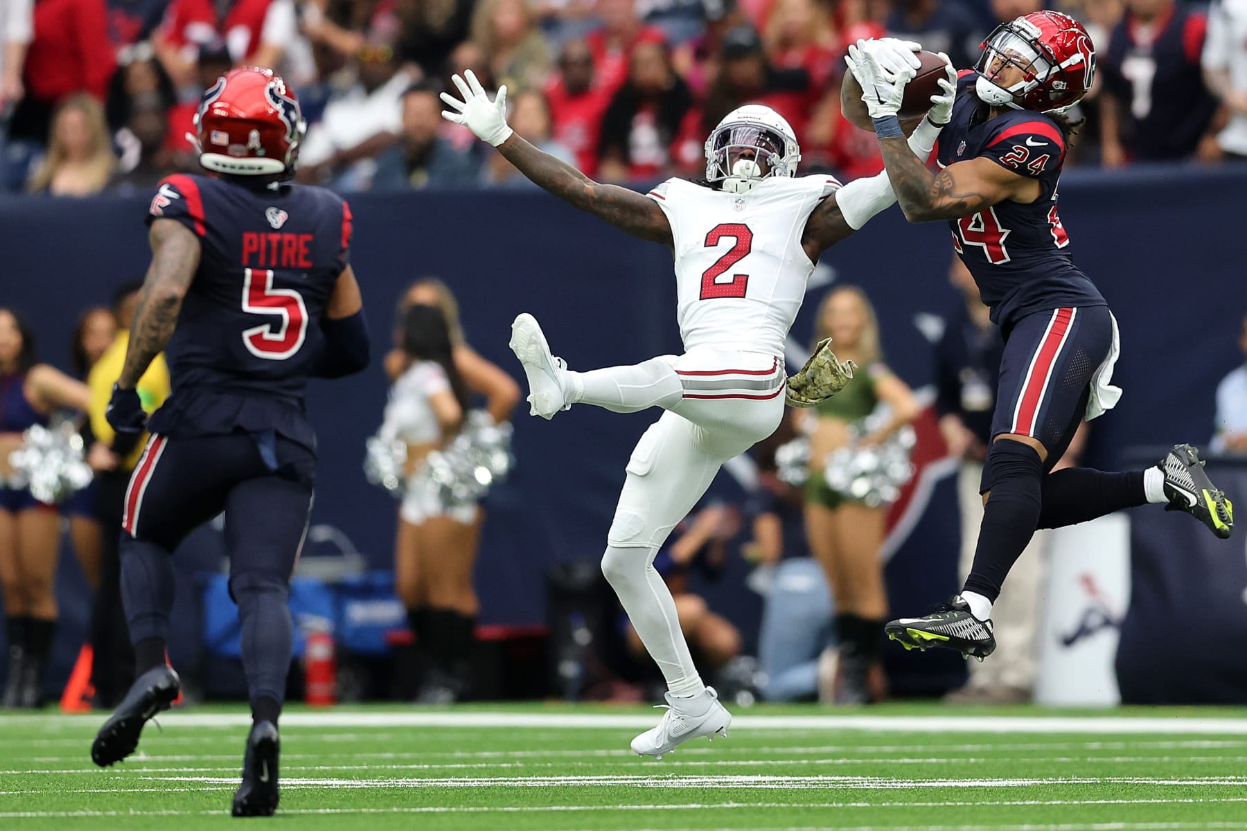 HOUSTON, TEXAS - NOVEMBER 19: Derek Stingley Jr. #24 of the Houston Texans intercepts a pass intended for Marquise Brown #2 of the Arizona Cardinals during the second quarter at NRG Stadium on November 19, 2023 in Houston, Texas. (Photo by Tim Warner/Getty Images)