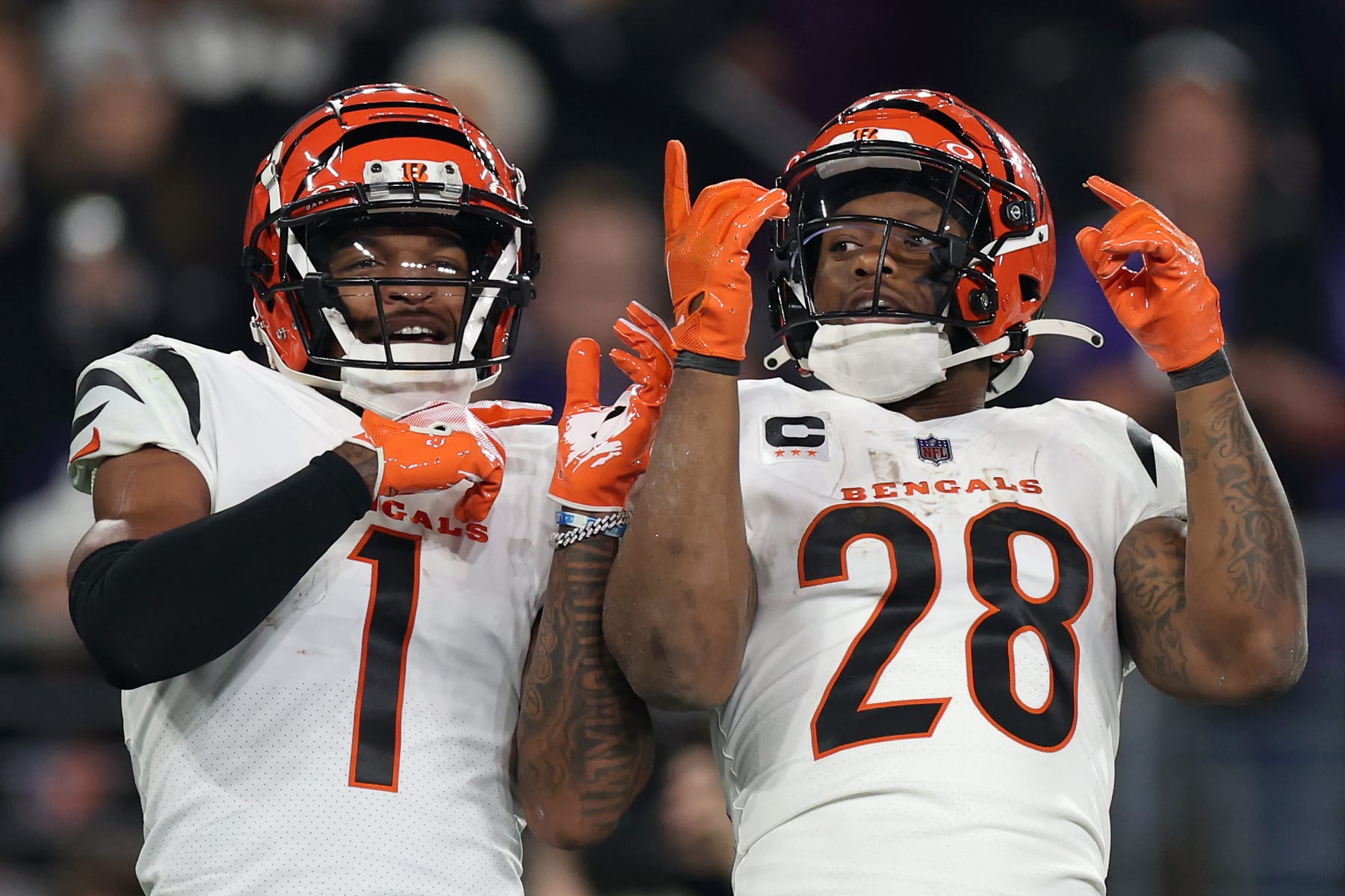 BALTIMORE, MARYLAND - NOVEMBER 16: Joe Mixon #28 of the Cincinnati Bengals celebrates with Ja'Marr Chase #1 after scoring a touchdown against the Baltimore Ravens during the second quarter of the game at M&T Bank Stadium on November 16, 2023 in Baltimore, Maryland. (Photo by Rob Carr/Getty Images)