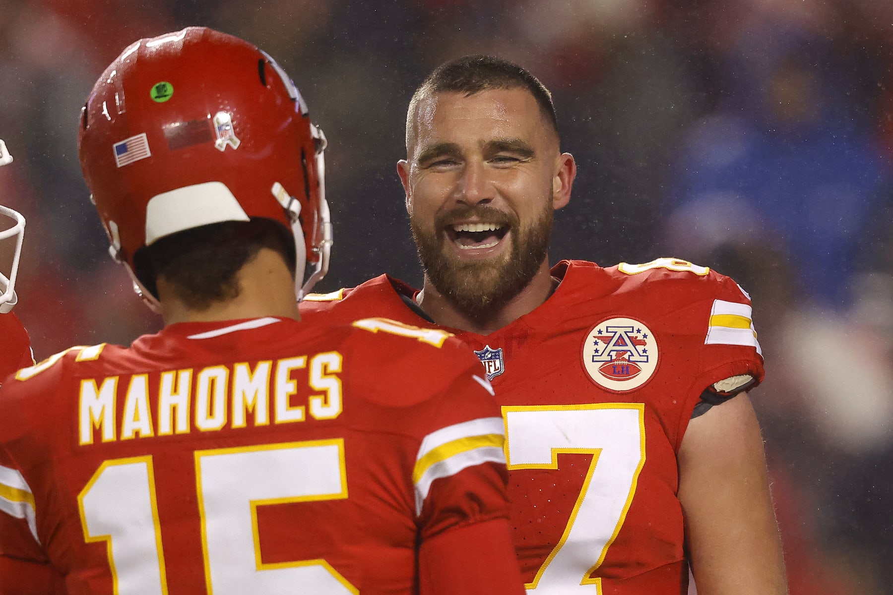 KANSAS CITY, MISSOURI - NOVEMBER 20: Travis Kelce #87 of the Kansas City Chiefs talks to Patrick Mahomes #15 before their game against the Philadelphia Eagles at GEHA Field at Arrowhead Stadium on November 20, 2023 in Kansas City, Missouri. (Photo by David Eulitt/Getty Images)