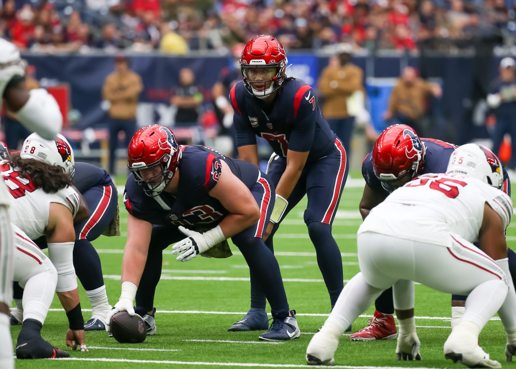 HOUSTON, TX - NOVEMBER 19: Houston Texans center Michael Deiter (63) snaps the ball to Houston Texans quarterback C.J. Stroud (7) in the second quarter during the NFL game between the Arizona Cardinals and Houston Texans on November 19, 2023 at NRG Stadium in Houston, Texas. (Photo by Leslie Plaza Johnson/Icon Sportswire via Getty Images)