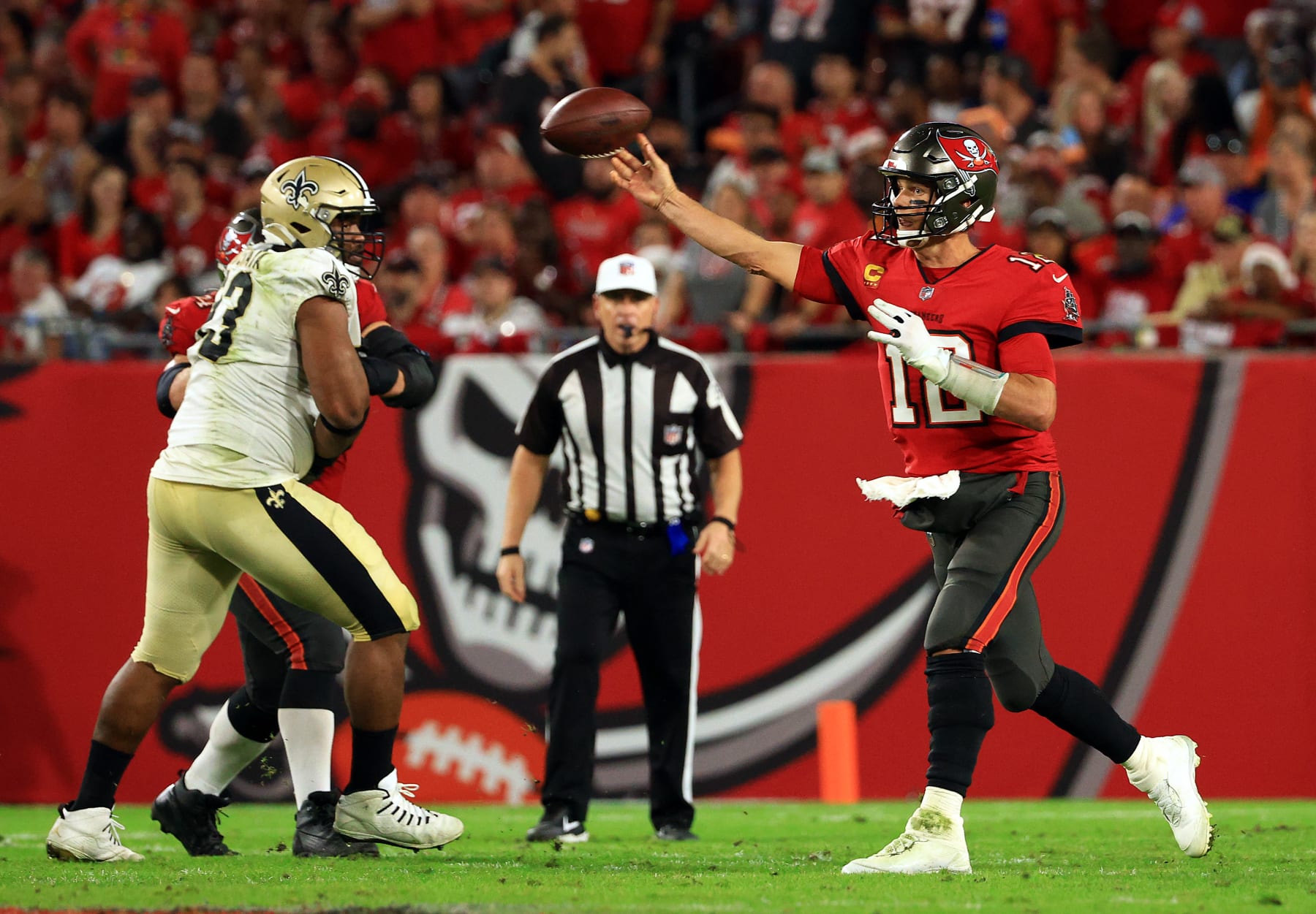 TAMPA, FLORIDA - DECEMBER 19: Tom Brady #12 of the Tampa Bay Buccaneers passes during the game against the New Orleans Saints at Raymond James Stadium on December 19, 2021 in Tampa, Florida. (Photo by Mike Ehrmann/Getty Images)