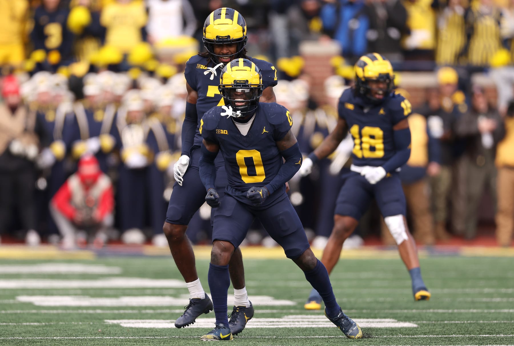ANN ARBOR, MICHIGAN - NOVEMBER 25: Mike Sainristil #0 of the Michigan Wolverines celebrates a defensive stop against the Ohio State Buckeyes during the second quarter in the game at Michigan Stadium on November 25, 2023 in Ann Arbor, Michigan. (Photo by Gregory Shamus/Getty Images)