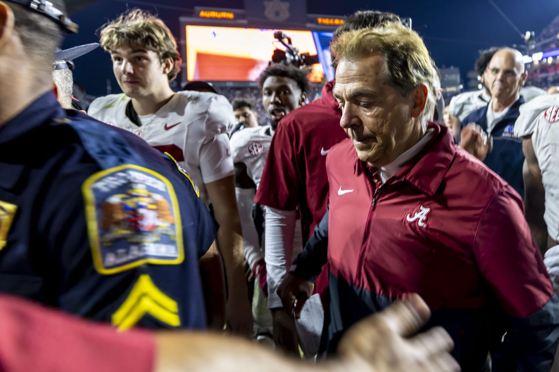 Alabama head coach Nick Saban, front right, departs the field after an NCAA college football game against Auburn, Saturday, Nov. 25, 2023, in Auburn, Ala. (AP Photo/Vasha Hunt)