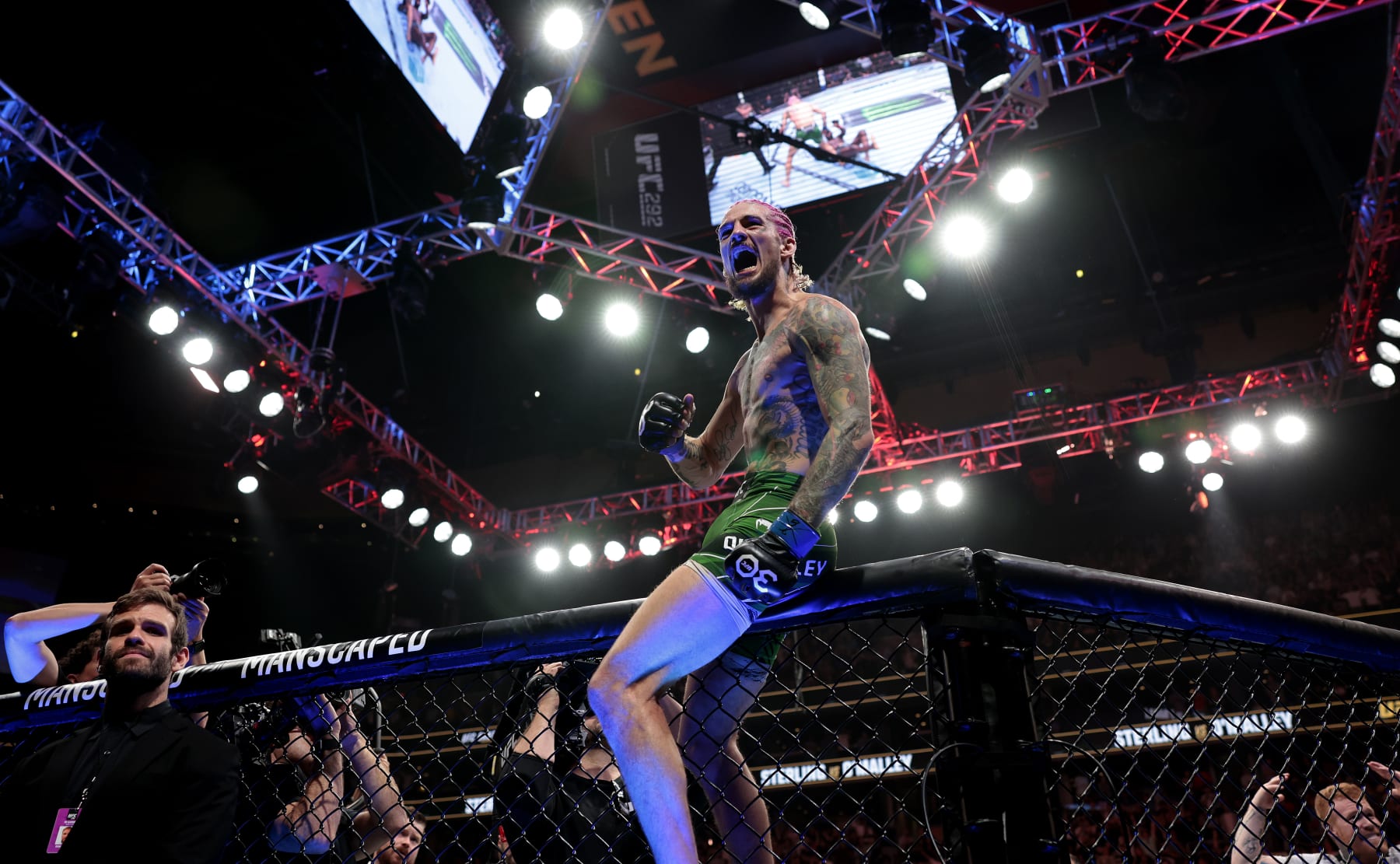 Sean O'Malley celebrates after he defeats Aljamain Sterling by TKO for the bantamweight title