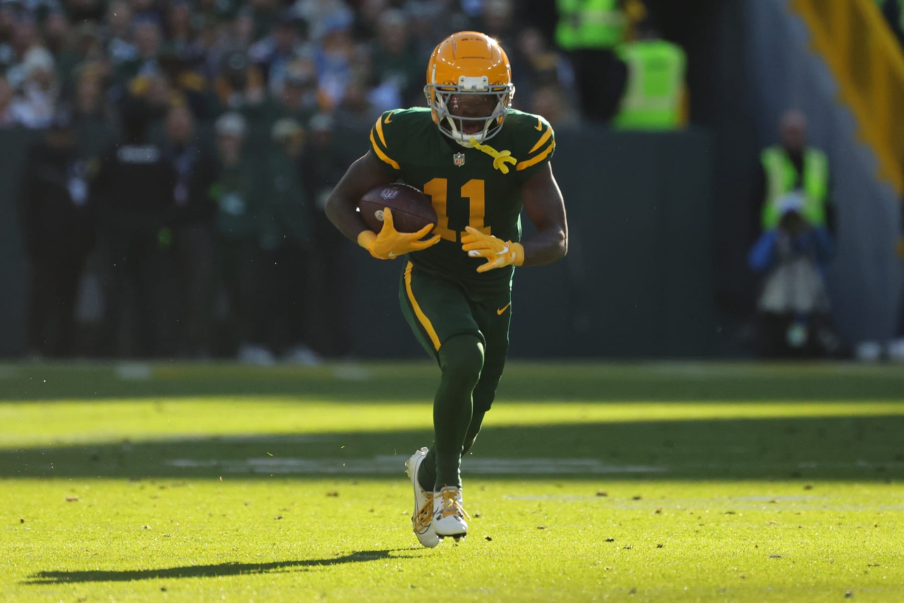 GREEN BAY, WISCONSIN - NOVEMBER 19: Jayden Reed #11 of the Green Bay Packers runs for yards during a game against the Los Angeles Chargers at Lambeau Field on November 19, 2023 in Green Bay, Wisconsin. The Packers defeated the Chargers 23-20. (Photo by Stacy Revere/Getty Images)