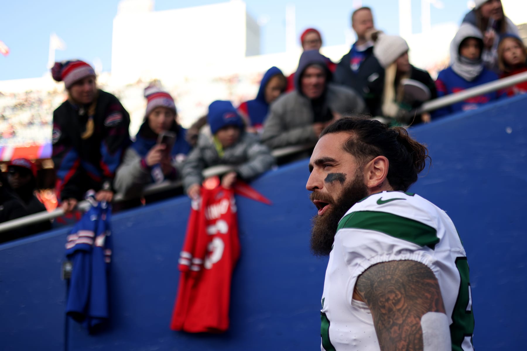 ORCHARD PARK, NEW YORK - NOVEMBER 19: Tyler Conklin #83 of the New York Jets reacts while walking to the field prior to a game against the Buffalo Bills at Highmark Stadium on November 19, 2023 in Orchard Park, New York. (Photo by Bryan Bennett/Getty Images)