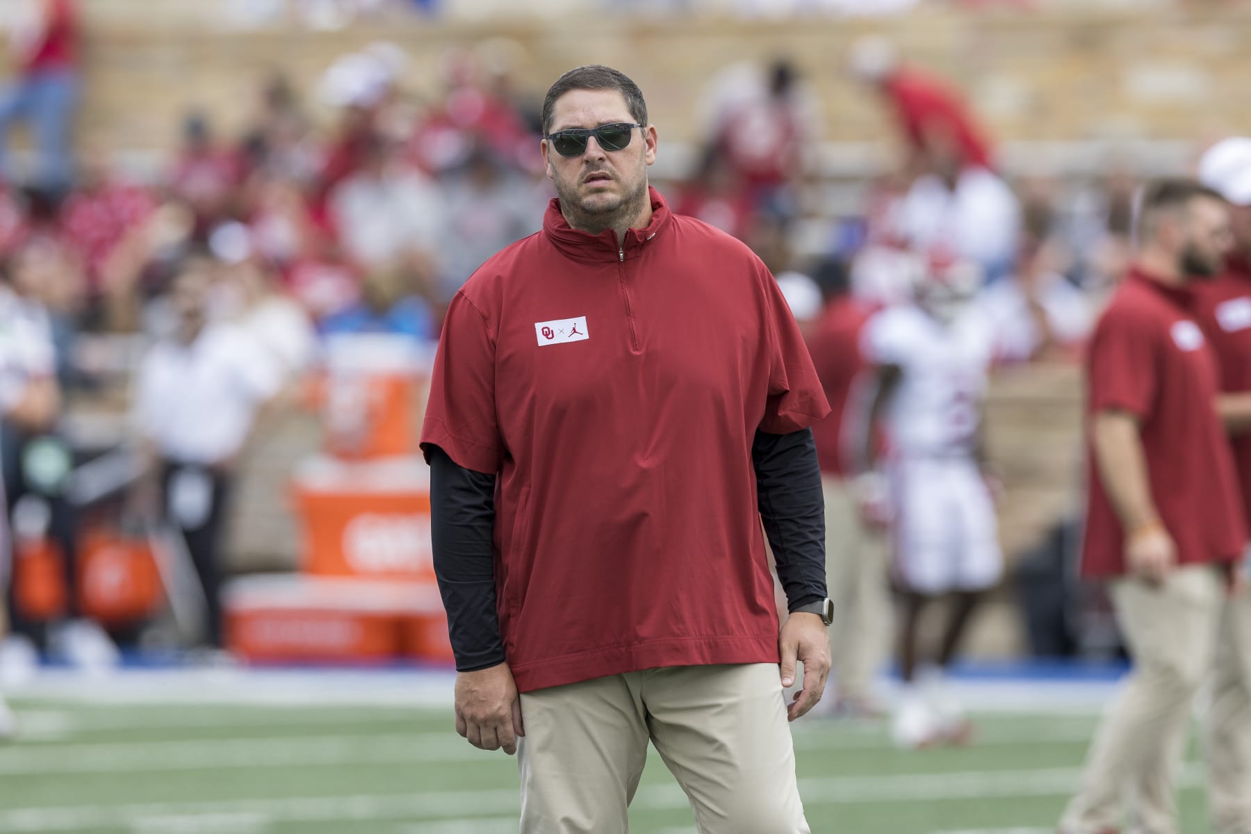 Oklahoma offensive coordinator Jeff Lebby watches his team warm up before an NCAA college football game Saturday, Sept. 16, 2023, in Tulsa, Okla. (AP Photo/Alonzo Adams)