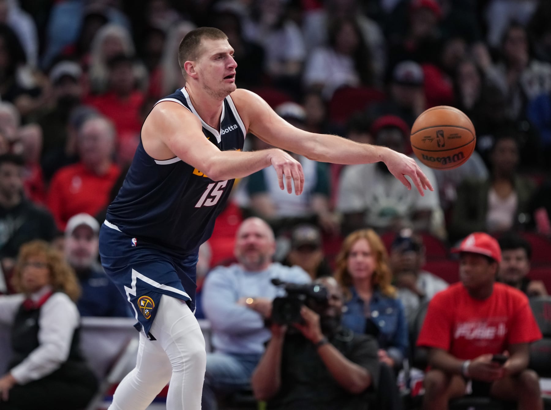 HOUSTON, TEXAS - NOVEMBER 24: Nikola Jokic #15 of the Denver Nuggets passes the ball during an NBA In-Season Tournament game against the Houston Rockets at Toyota Center on November 24, 2023 in Houston, Texas. NOTE TO USER: User expressly acknowledges and agrees that, by downloading and or using this photograph, User is consenting to the terms and conditions of the Getty Images License Agreement. (Photo by Alex Bierens de Haan/Getty Images)