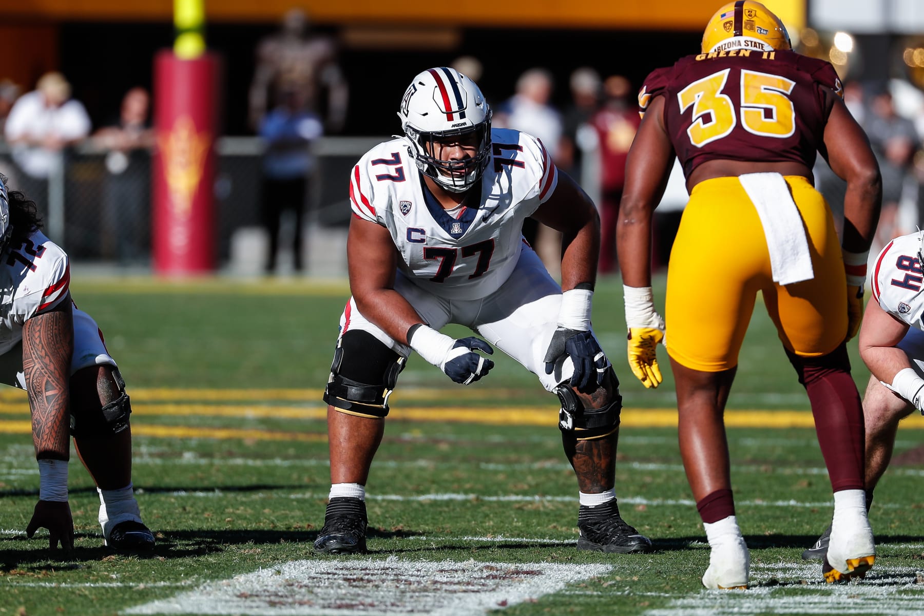 TEMPE, AZ - NOVEMBER 25:  Arizona Wildcats offensive lineman Jordan Morgan (77) line up during the college football game between the Arizona Wildcats and the Arizona State Sun Devils on November 25, 2023 at Mountain America Stadium in Tempe, Arizona. (Photo by Kevin Abele/Icon Sportswire via Getty Images)