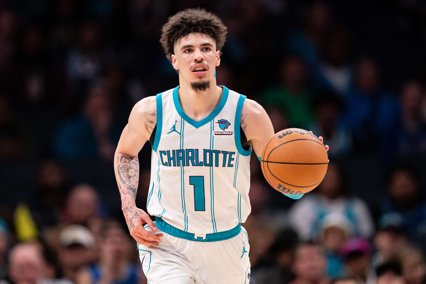 CHARLOTTE, NORTH CAROLINA - NOVEMBER 22: LaMelo Ball #1 of the Charlotte Hornets brings the ball up court against the Washington Wizards during their game at Spectrum Center on November 22, 2023 in Charlotte, North Carolina. NOTE TO USER: User expressly acknowledges and agrees that, by downloading and or using this photograph, User is consenting to the terms and conditions of the Getty Images License Agreement. (Photo by Jacob Kupferman/Getty Images)
