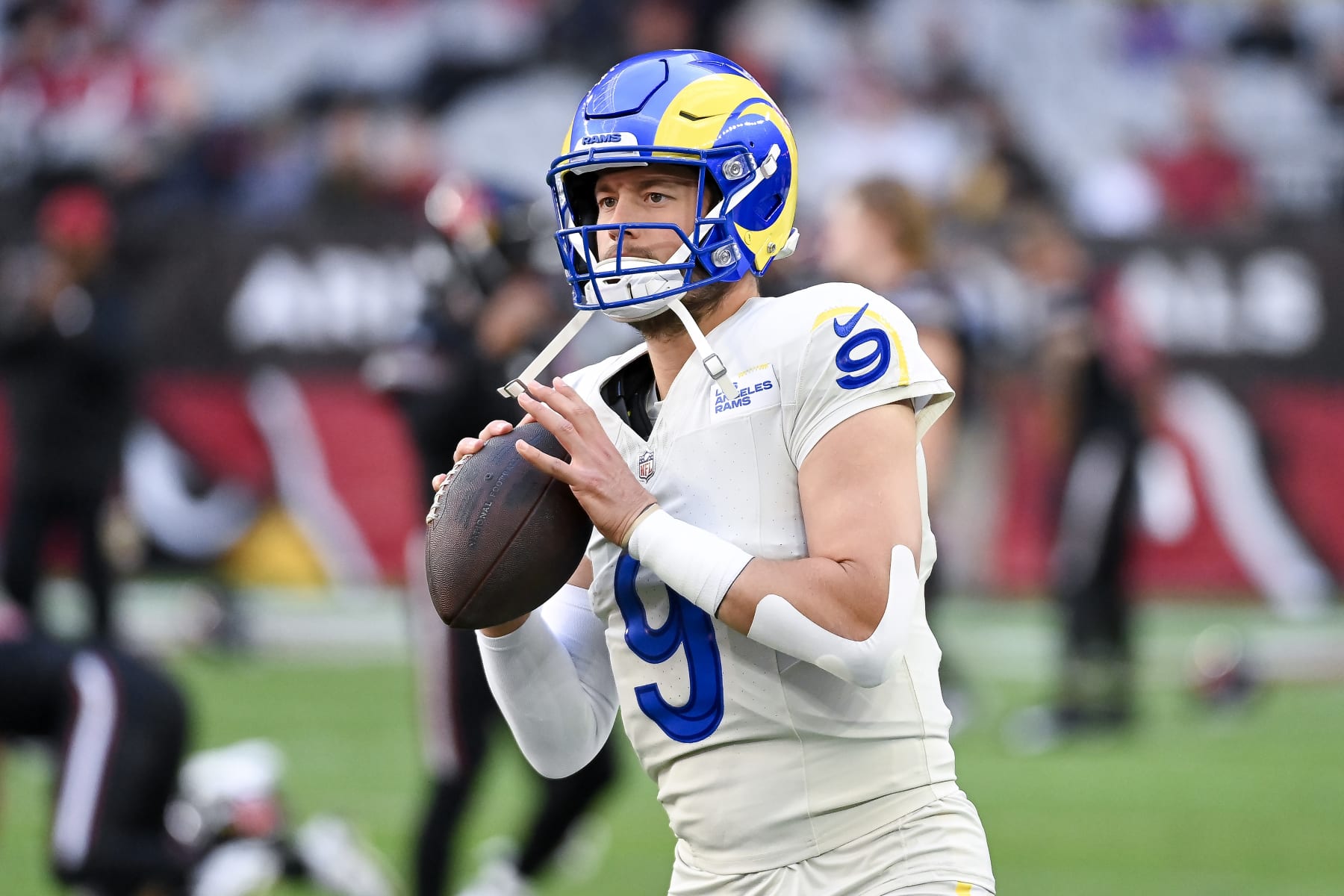 GLENDALE, ARIZONA - NOVEMBER 26: Matthew Stafford #9 of the Los Angeles Rams warms up prior to a game against the Arizona Cardinals at State Farm Stadium on November 26, 2023 in Glendale, Arizona. (Photo by Norm Hall/Getty Images)