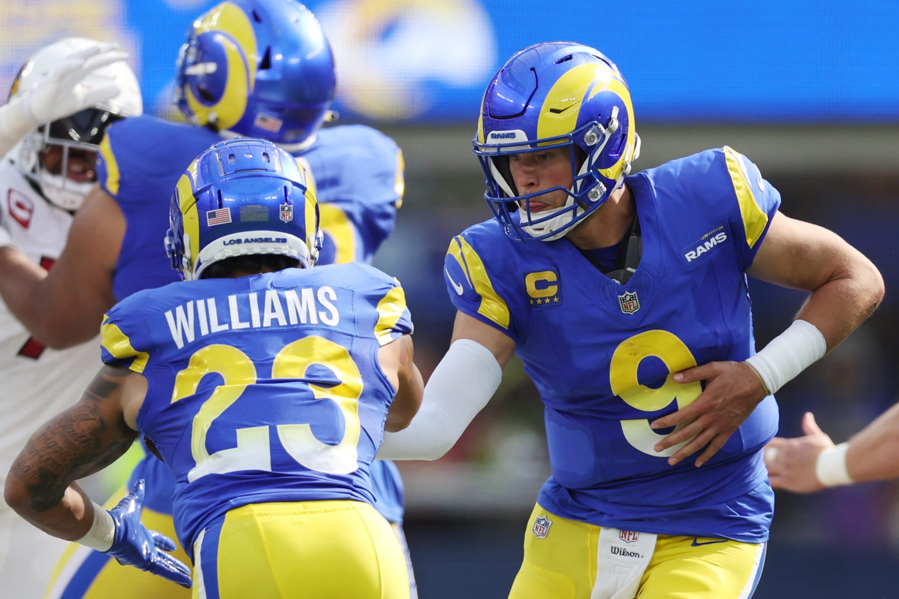 INGLEWOOD, CALIFORNIA - OCTOBER 15: Matthew Stafford #9 of the Los Angeles Rams hands off the ball to Kyren Williams #23 of the Los Angeles Rams during the second quarter against the Arizona Cardinals at SoFi Stadium on October 15, 2023 in Inglewood, California. (Photo by Harry How/Getty Images)