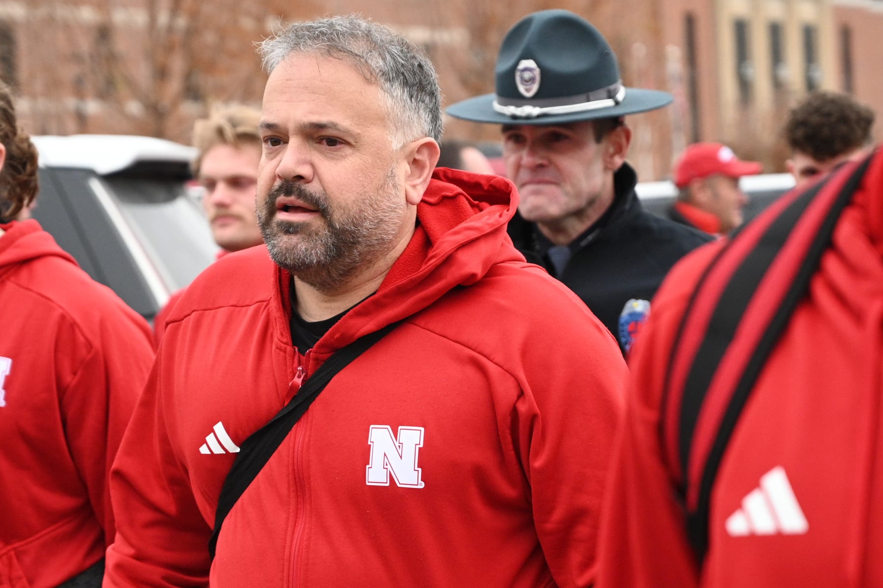 LINCOLN, NEBRASKA - NOVEMBER 24: Head coach Matt Rhule of the Nebraska Cornhuskers walks in the team before the game against the Iowa Hawkeyes at Memorial Stadium on November 24, 2023 in Lincoln, Nebraska. (Photo by Steven Branscombe/Getty Images)