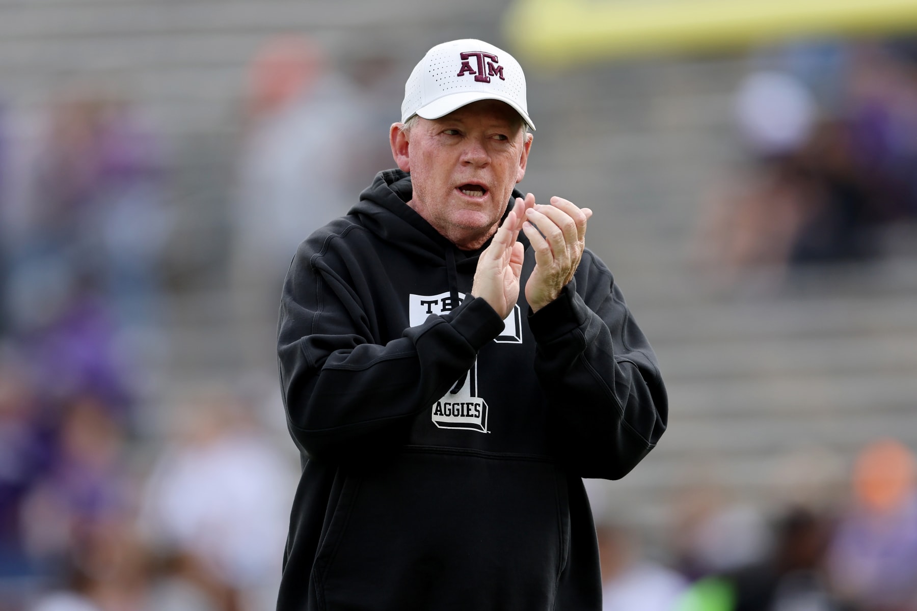 COLLEGE STATION, TEXAS - NOVEMBER 18: Offensive coordinator Bobby Petrino of the Texas A&M Aggies watches players warm up before the game against the Abilene Christian Wildcats at Kyle Field on November 18, 2023 in College Station, Texas. (Photo by Tim Warner/Getty Images)