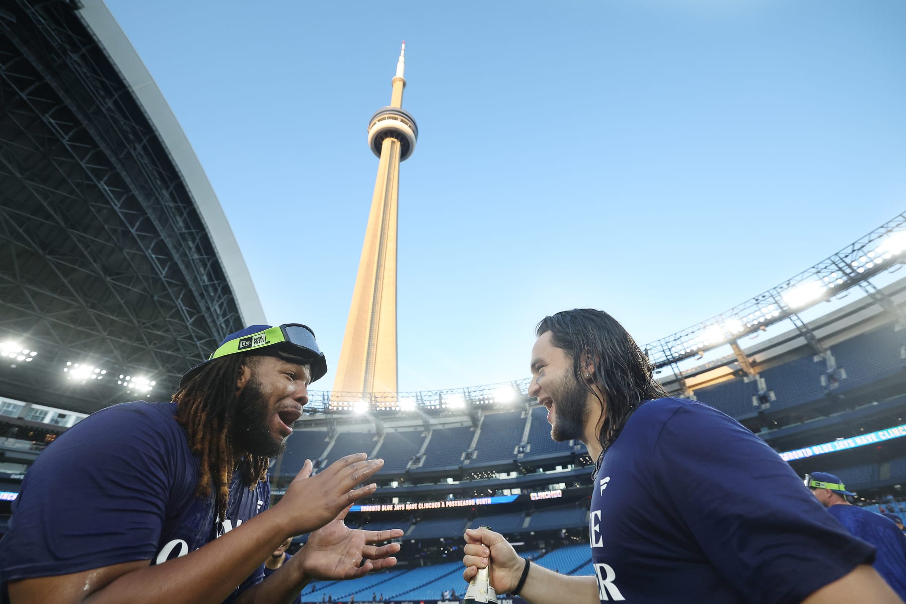TORONTO, ON - OCTOBER 1 - Toronto Blue Jays first baseman Vladimir Guerrero Jr. (27) and Toronto Blue Jays shortstop Bo Bichette (11) celebrate clinching a wild card berth in the MLB play-offs as the Toronto Blue Jays play the Tampa Bay Rays in the season finale at Rogers Centre in Toronto. October 1, 2023. (Steve Russell/Toronto Star via Getty Images)