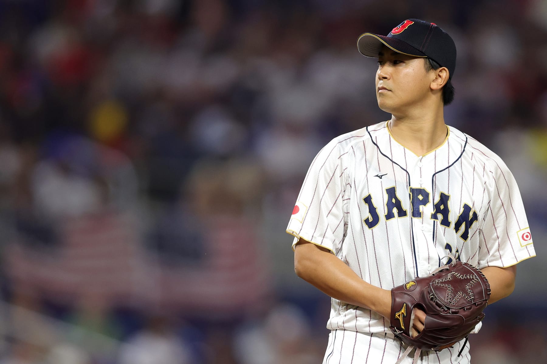 MIAMI, FLORIDA - MARCH 21: Shota Imanaga #21 of Team Japan pitches in the first inning against Team USA during the World Baseball Classic Championship at loanDepot park on March 21, 2023 in Miami, Florida. (Photo by Megan Briggs/Getty Images)