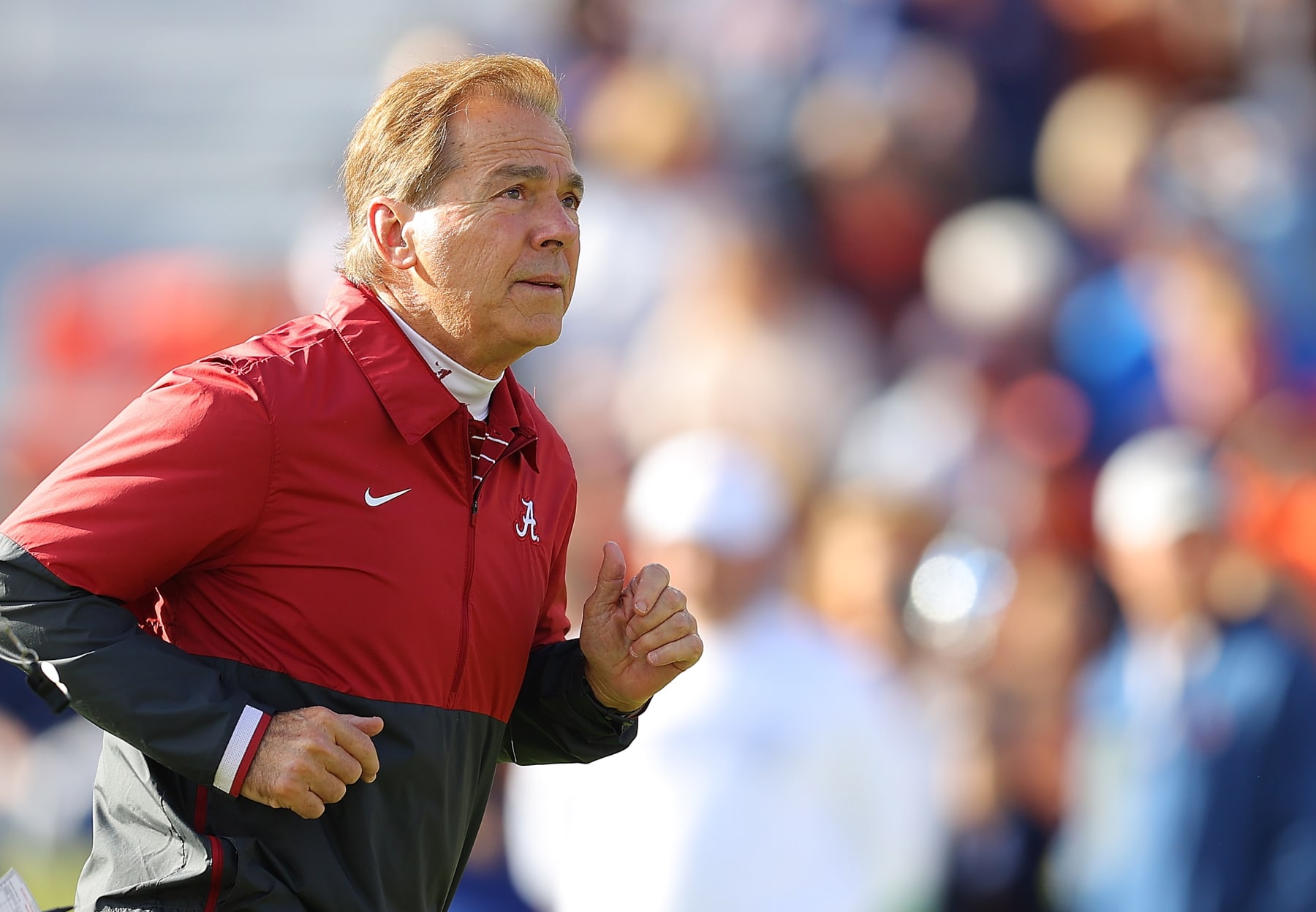 AUBURN, ALABAMA - NOVEMBER 25: Head coach Nick Saban of the Alabama Crimson Tide runs down the field during warm up prior to the game against Auburn Tigers at Jordan-Hare Stadium on November 25, 2023 in Auburn, Alabama. (Photo by Kevin C. Cox/Getty Images)