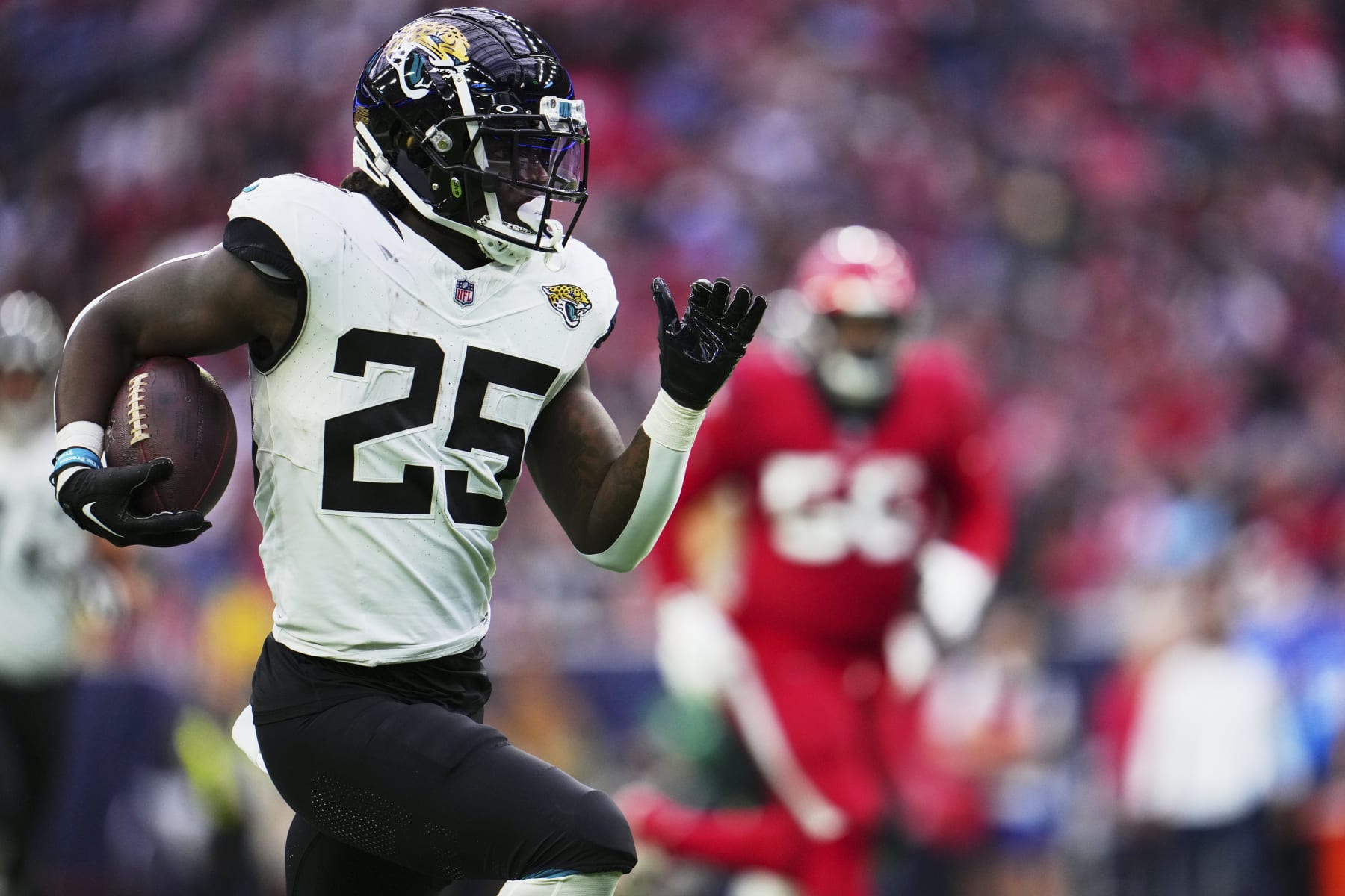 HOUSTON, TX - NOVEMBER 26: D'Ernest Johnson #25 of the Jacksonville Jaguars carries the ball against the Houston Texans during the first half at NRG Stadium on November 26, 2023 in Houston, Texas. (Photo by Cooper Neill/Getty Images) HOUSTON, TX - NOVEMBER 26: D'Ernest Johnson #25 of the Jacksonville Jaguars carries the ball against the Houston Texans during the first half at NRG Stadium on November 26, 2023 in Houston, Texas. (Photo by Cooper Neill/Getty Images)