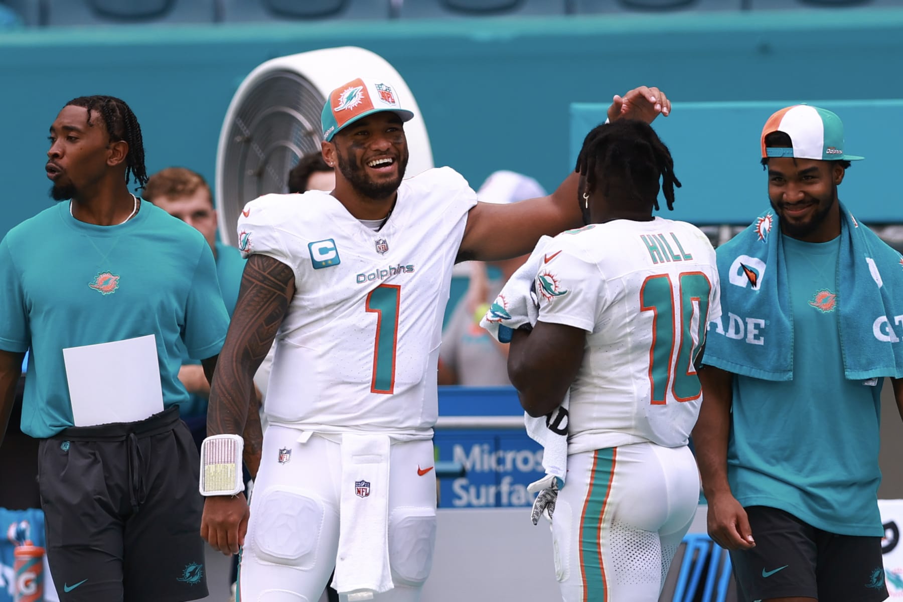 MIAMI GARDENS, FLORIDA - SEPTEMBER 24: Tua Tagovailoa #1 of the Miami Dolphins celebrates with Tyreek Hill #10 of the Miami Dolphins during the fourth quarter against the Denver Broncos at Hard Rock Stadium on September 24, 2023 in Miami Gardens, Florida. (Photo by Megan Briggs/Getty Images)