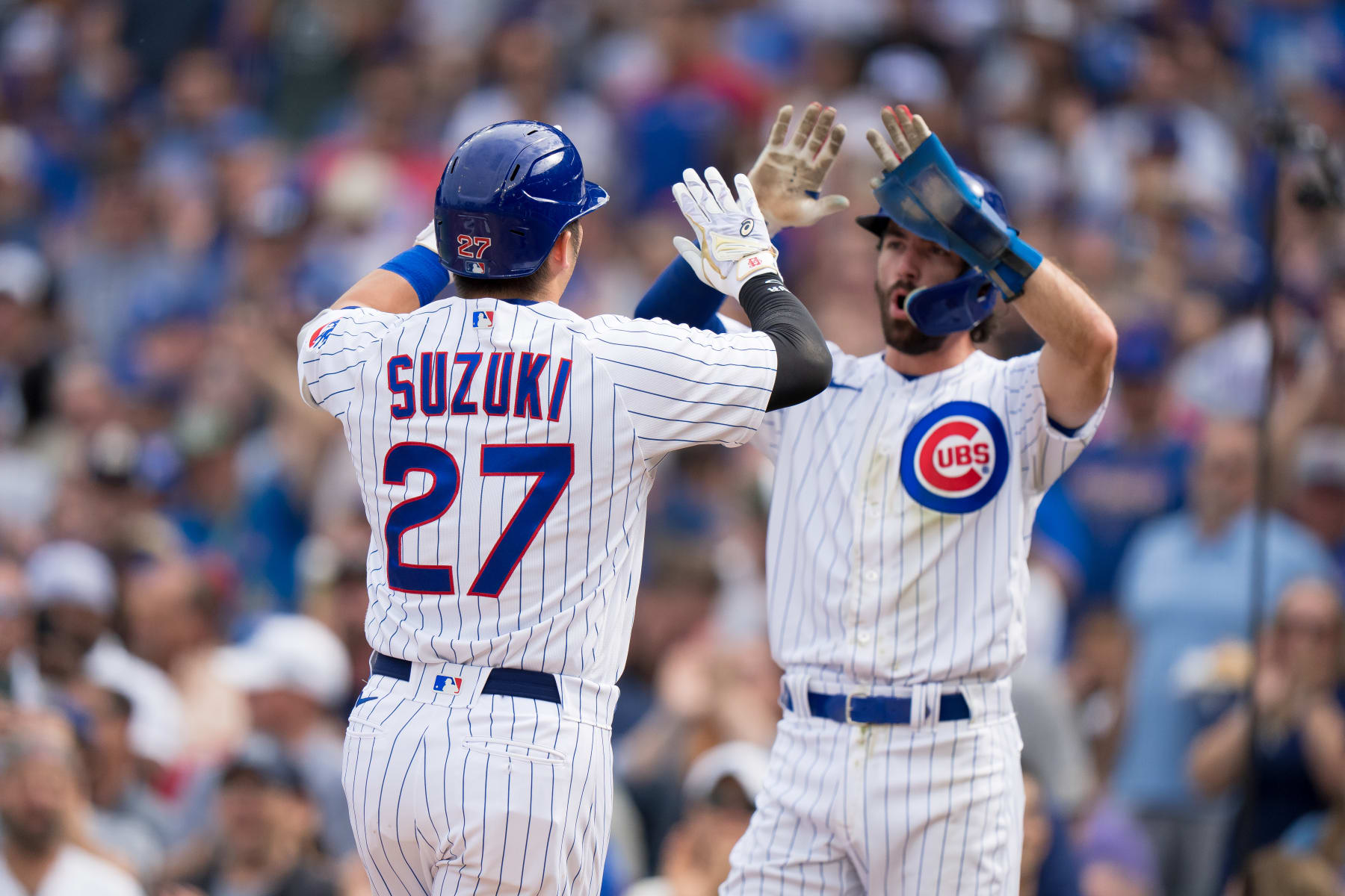 Seiya Suzuki (L) and Dansby Swanson (R)