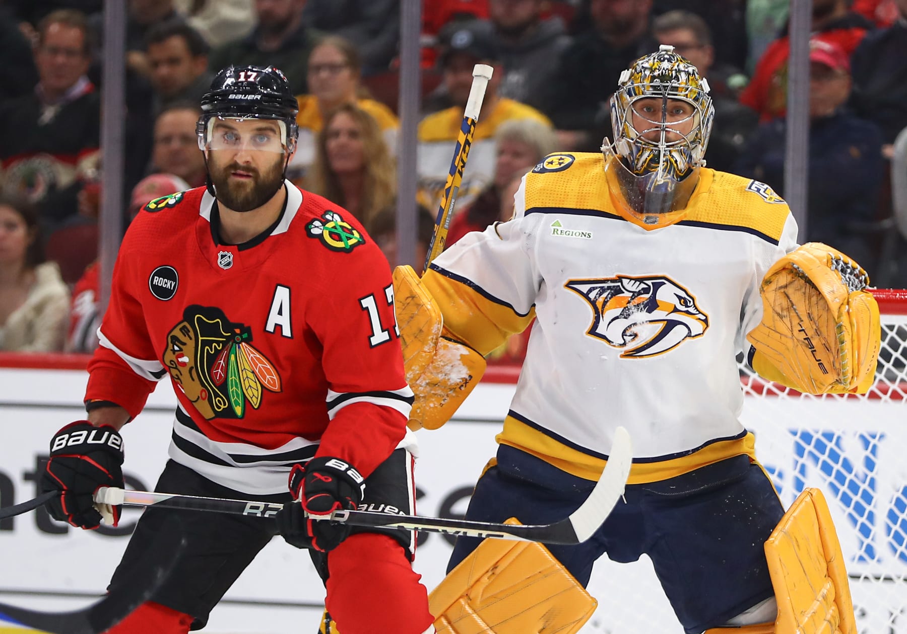 CHICAGO, IL - DECEMBER 05: Nick Foligno #17 of the Chicago Blackhawks stands in front of Juuse Saros #74 of the Nashville Predators during the first period at the United Center on December 5, 2023 in Chicago, Illinois. (Photo by Melissa Tamez/Icon Sportswire via Getty Images)