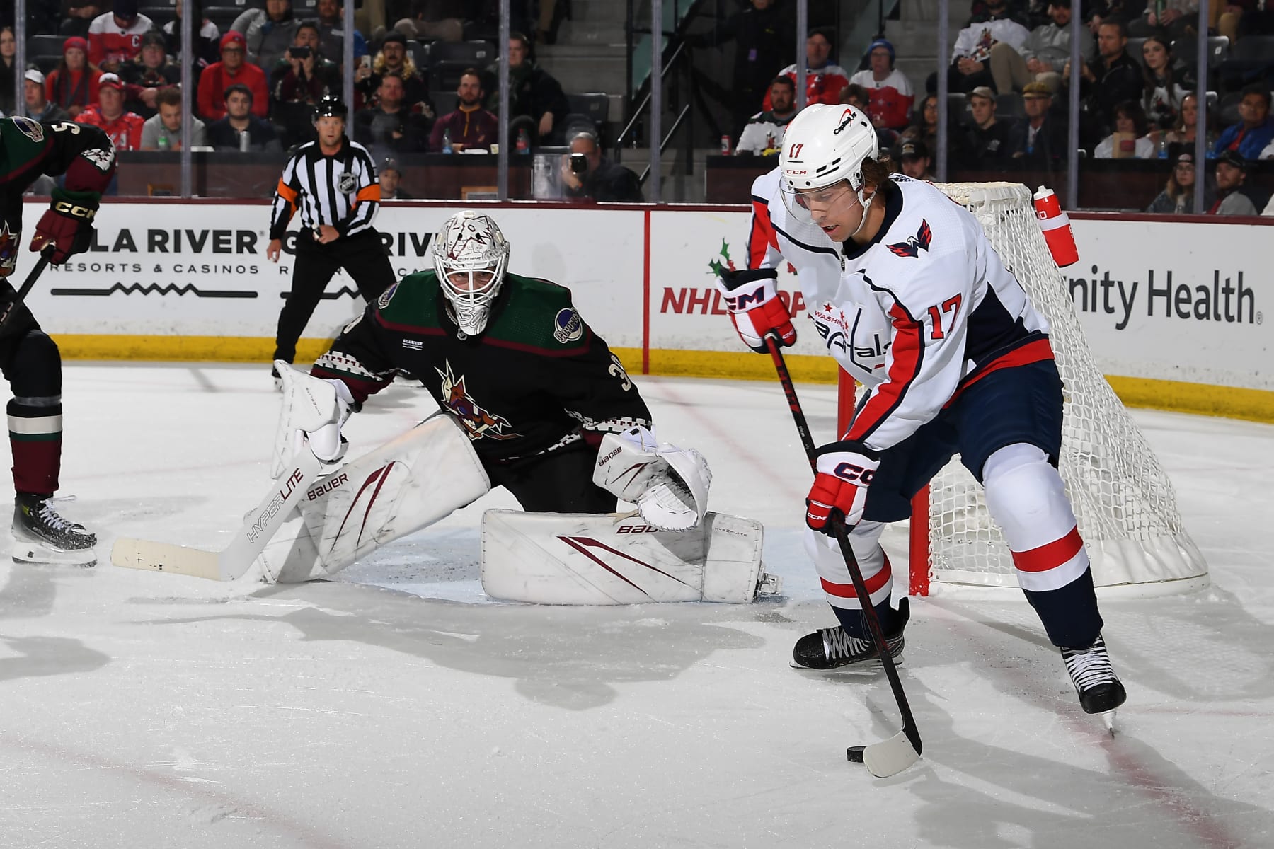 TEMPE, ARIZONA - DECEMBER 04: Dylan Strome #17 of the Washington Capitals skates with the puck as Connor Ingram #39 of the Arizona Coyotes gets ready to make a save during the second period of the game at Mullett Arena on December 04, 2023 in Tempe, Arizona. (Photo by Norm Hall/NHLI via Getty Images)