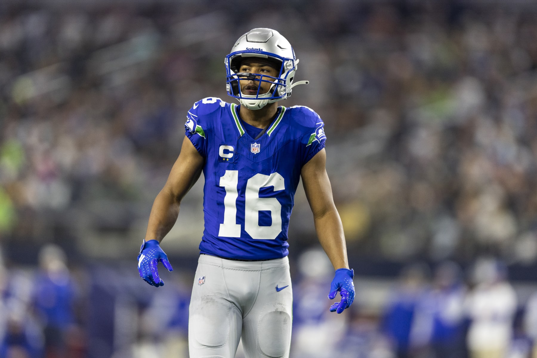 ARLINGTON, TEXAS - NOVEMBER 30: Tyler Lockett #16 of the Seattle Seahawks looks on during an NFL football game between the Dallas Cowboys and the Seattle Seahawks at AT&T Stadium on November 30, 2023 in Arlington, Texas. (Photo by Michael Owens/Getty Images)
